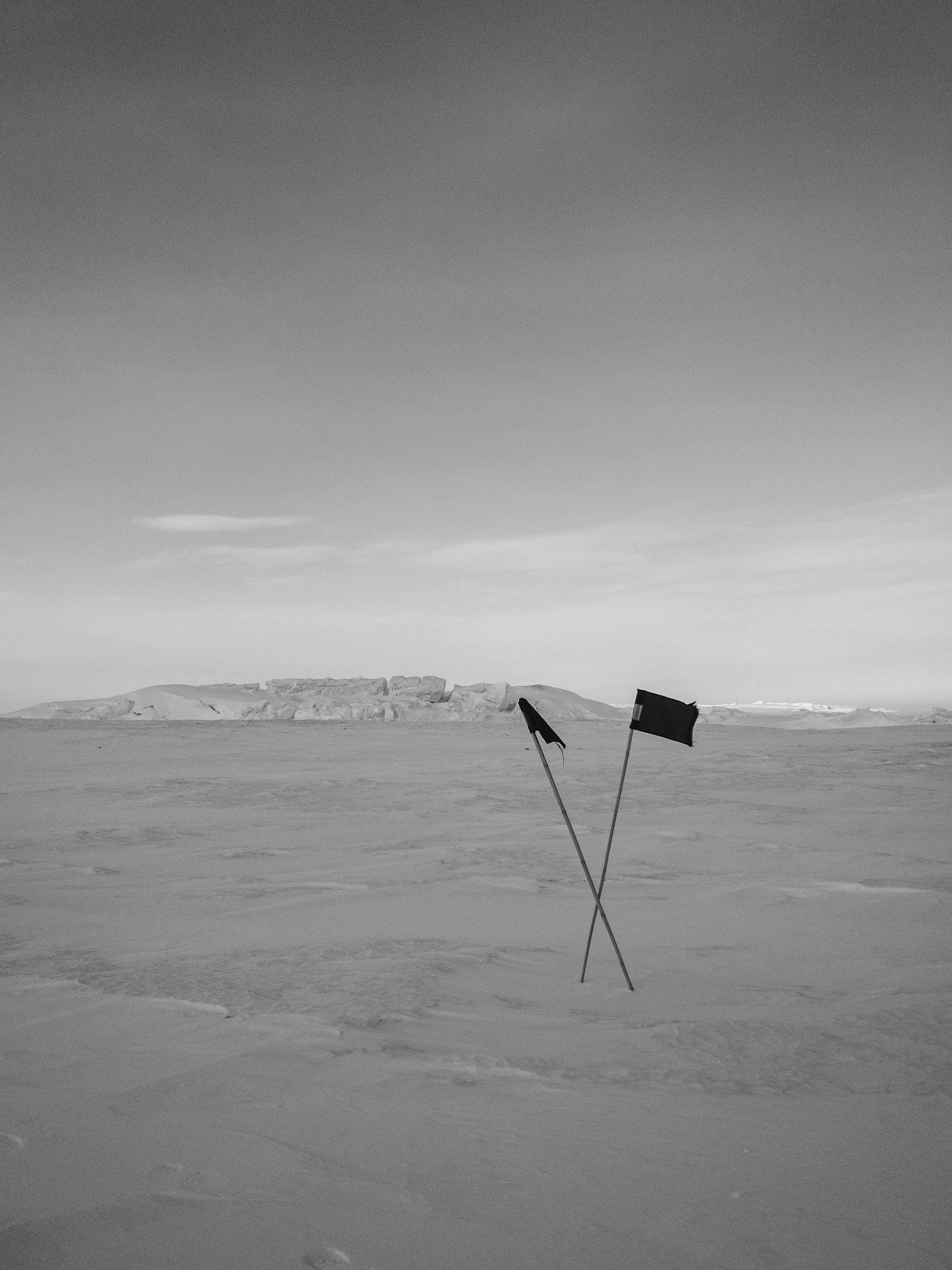 Black flags indicating where not to walk