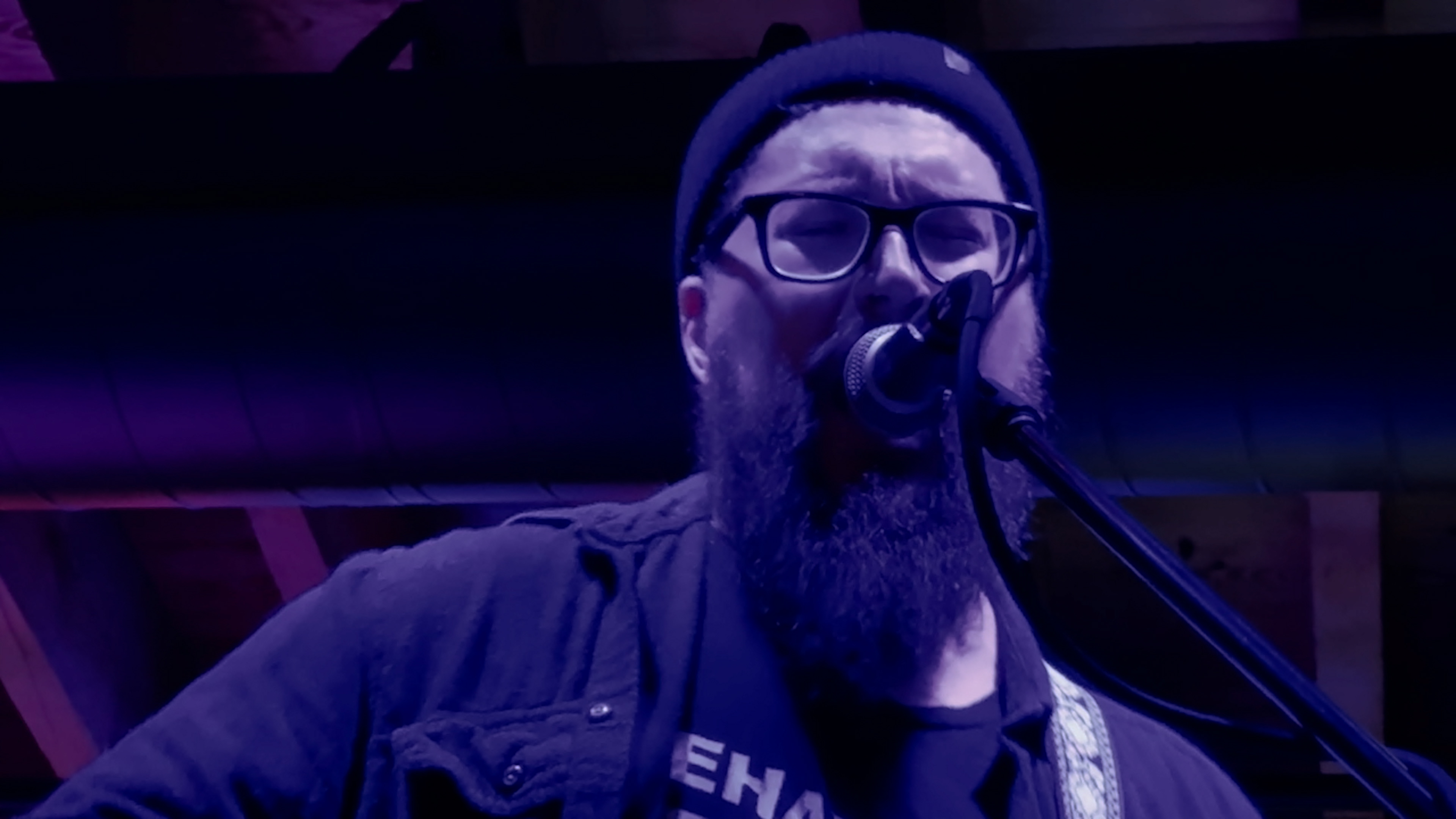 Chiseled Lilies perform at Nitro Bar in West Reading.  A male vocalist is in the center of the frame with ductwork visible behind his head.