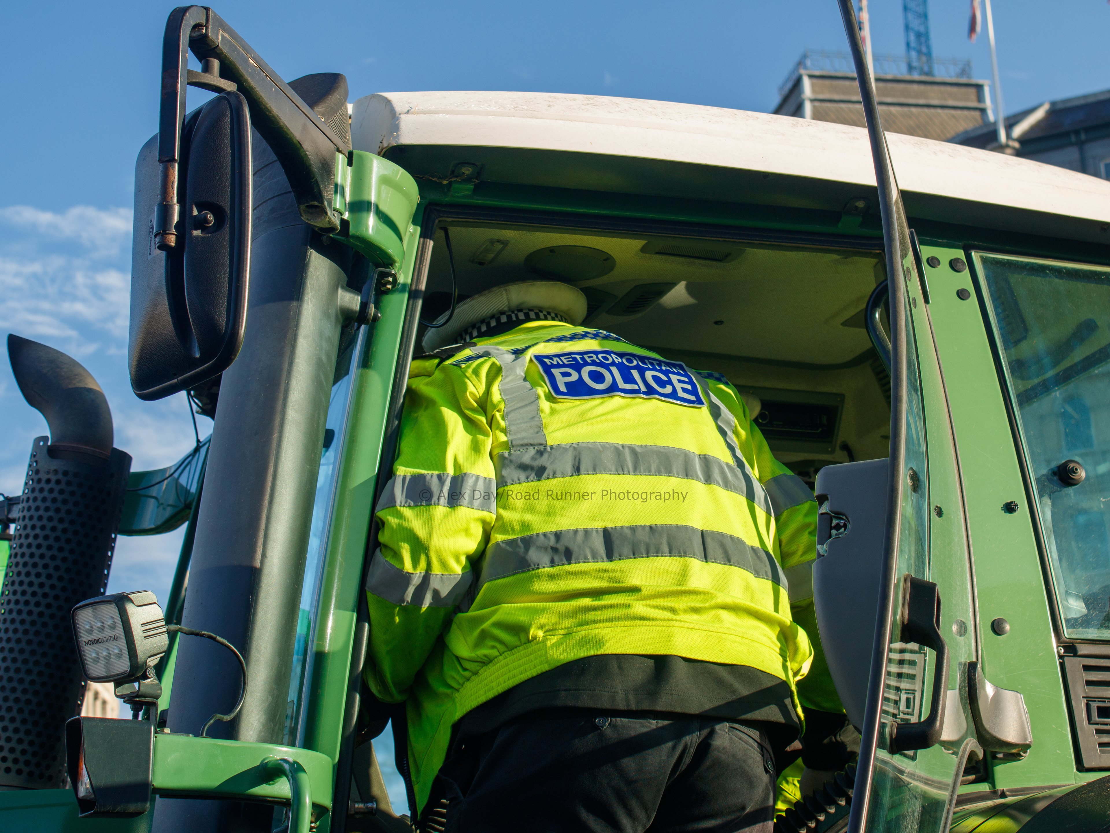 Police seize a tractor at a farmer's protest