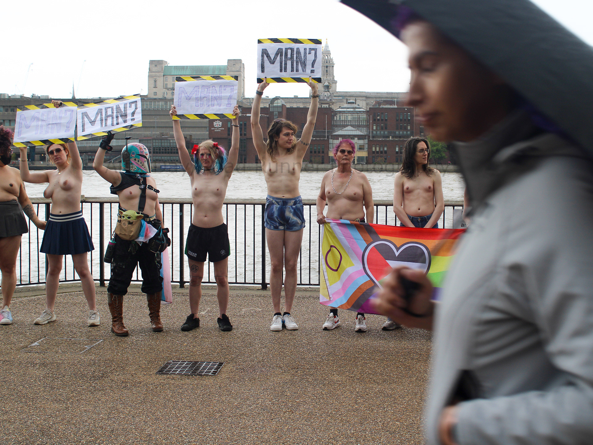 Topless trans activists take part in a protest