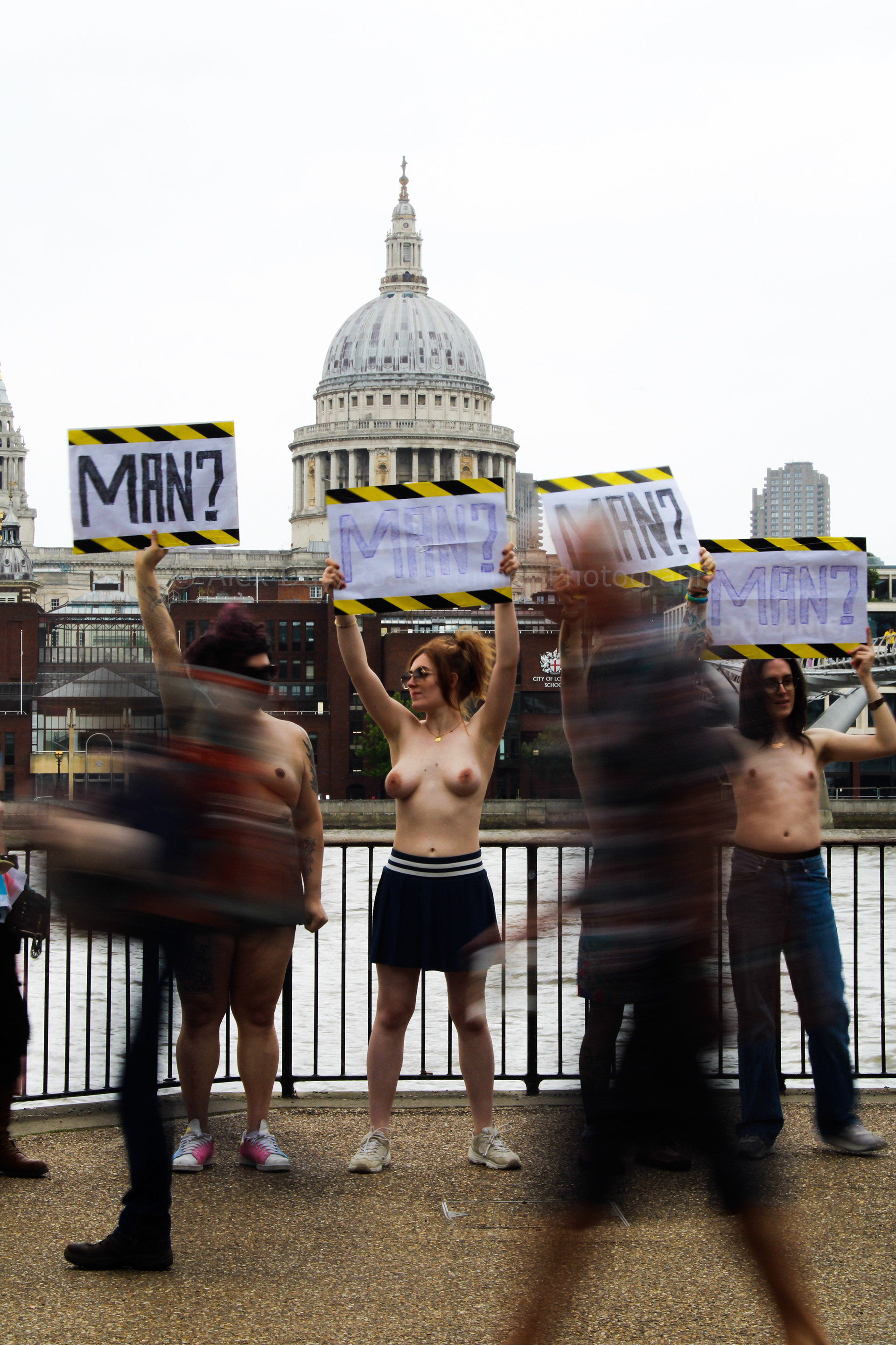 Topless trans activists take part in a protest