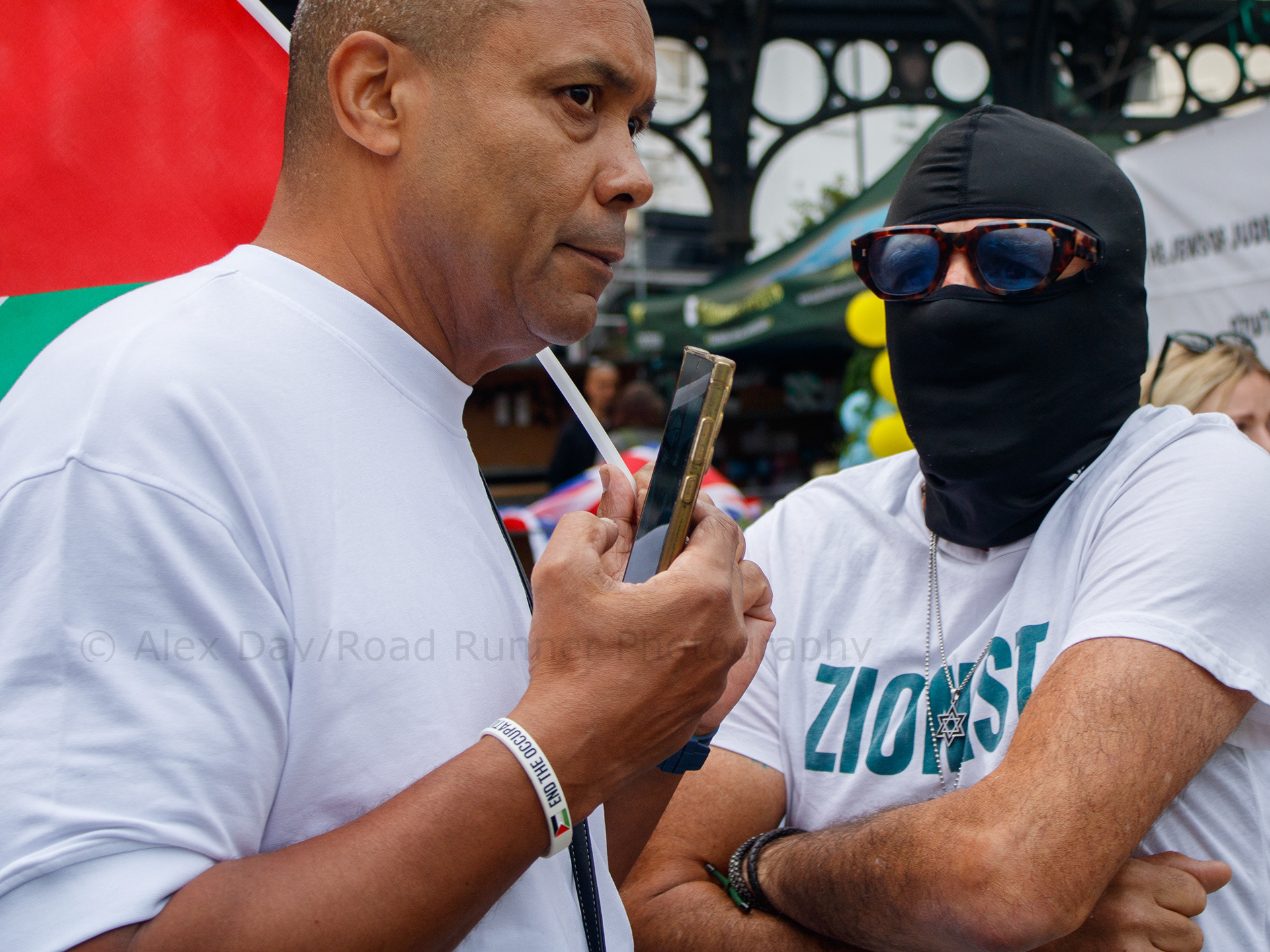 A Palestine and an Israeli protester engage in debate