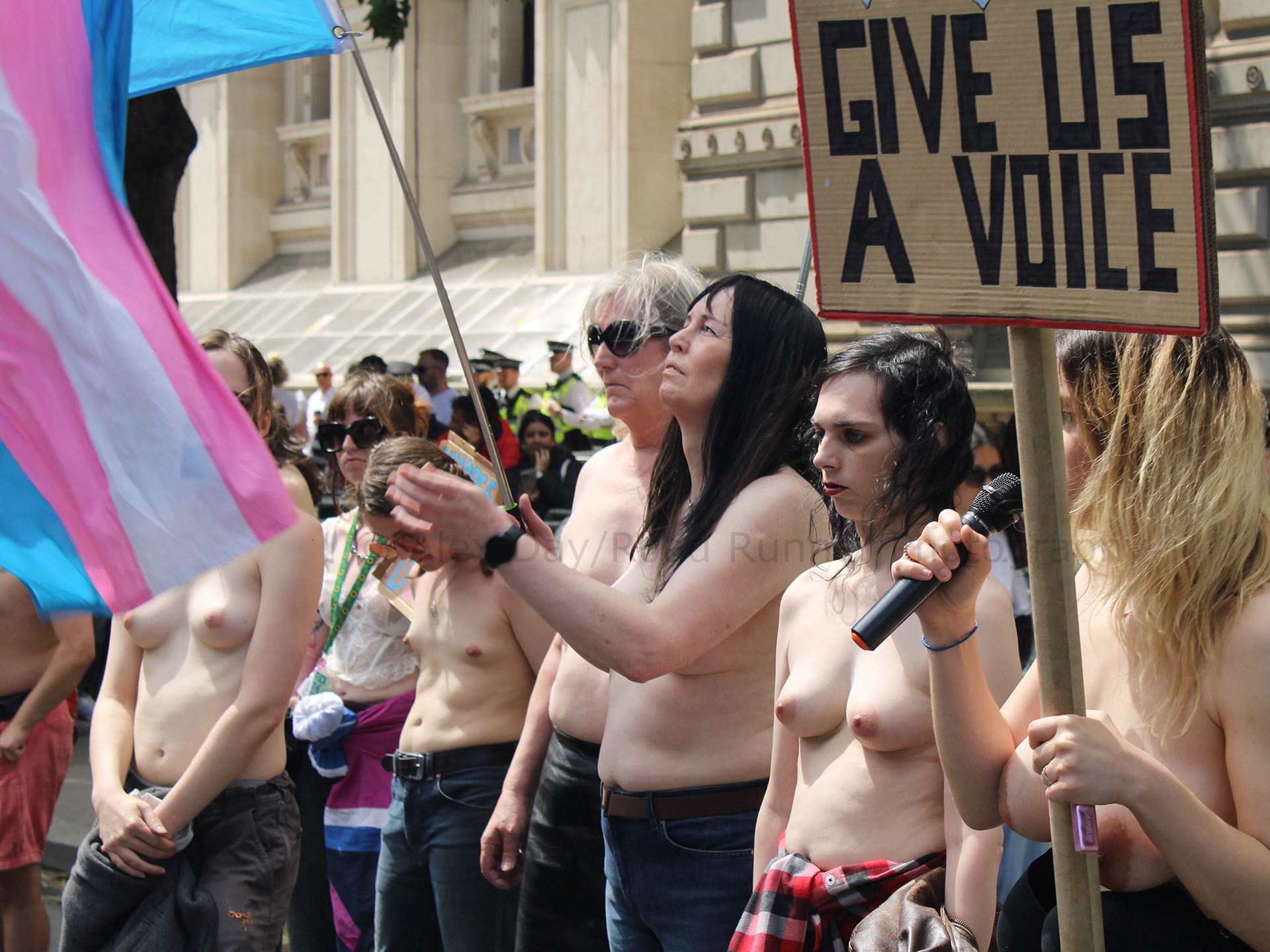 Topless trans activists take part in a protest