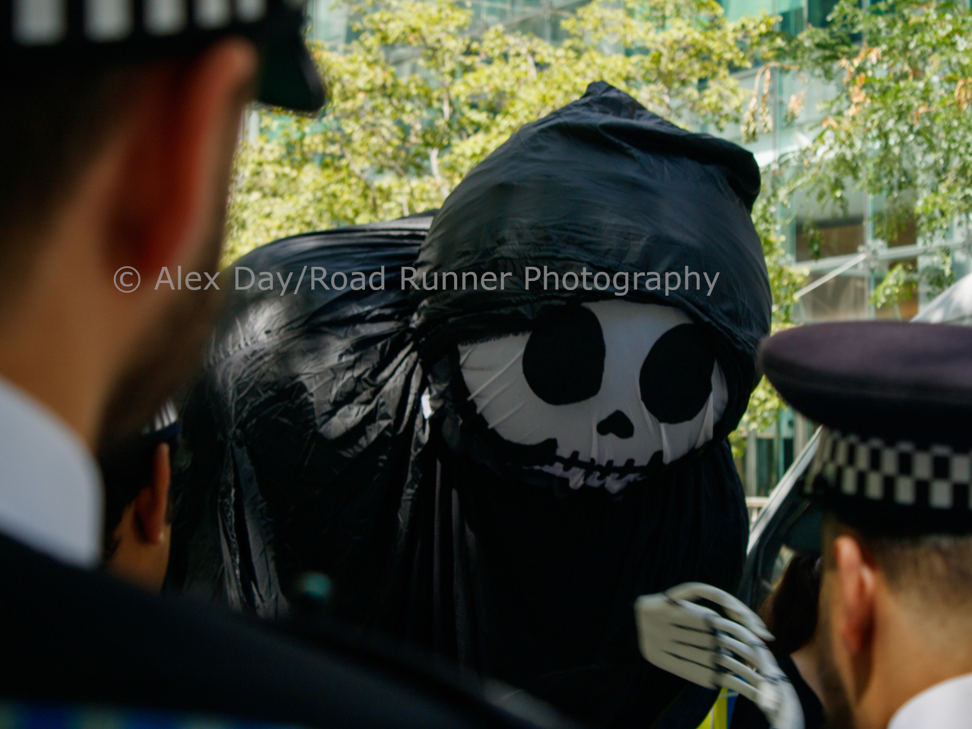 Death taunts police at a Cut The Ties protest