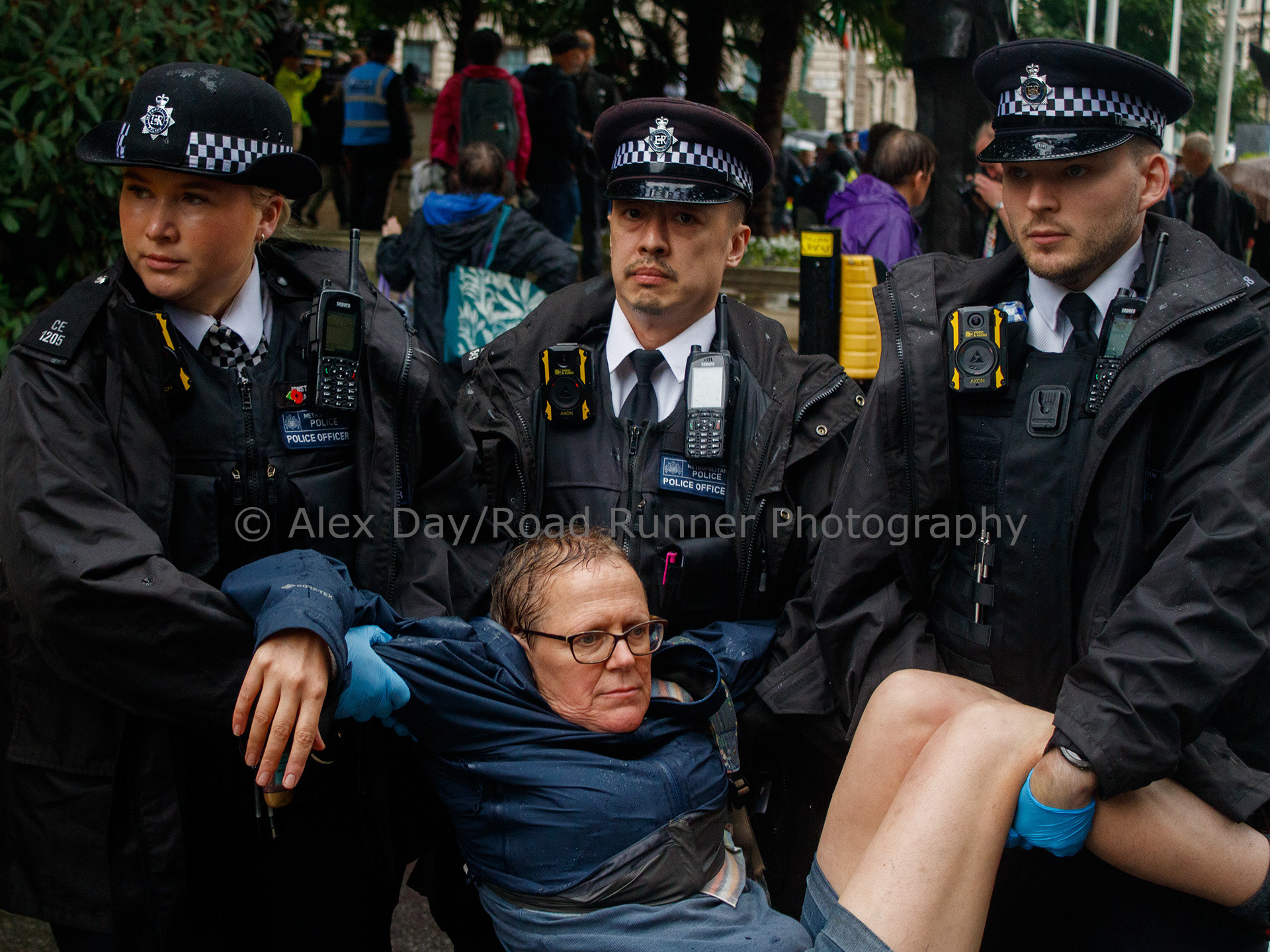 A protester is dragged away by police at a protest in support of Palestine Action