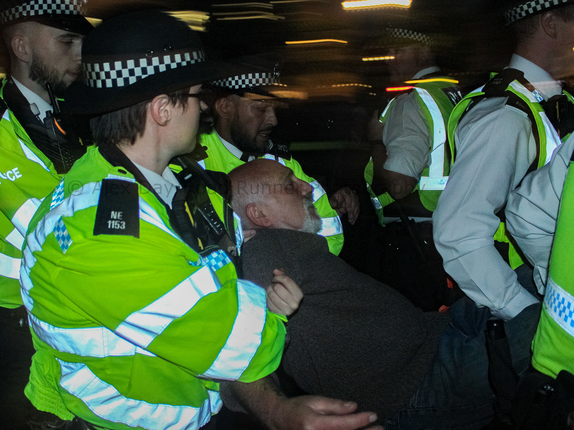 A protester is dragged away by police at a protest in support of Palestine Action