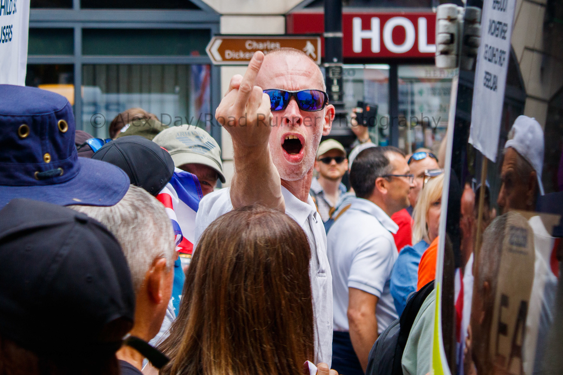A protester flips someone off