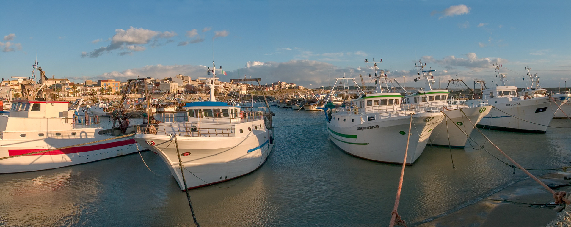 IT, SICILY, FEB 2, 2005 - Fishing boats at the Harbor of Scoglitty