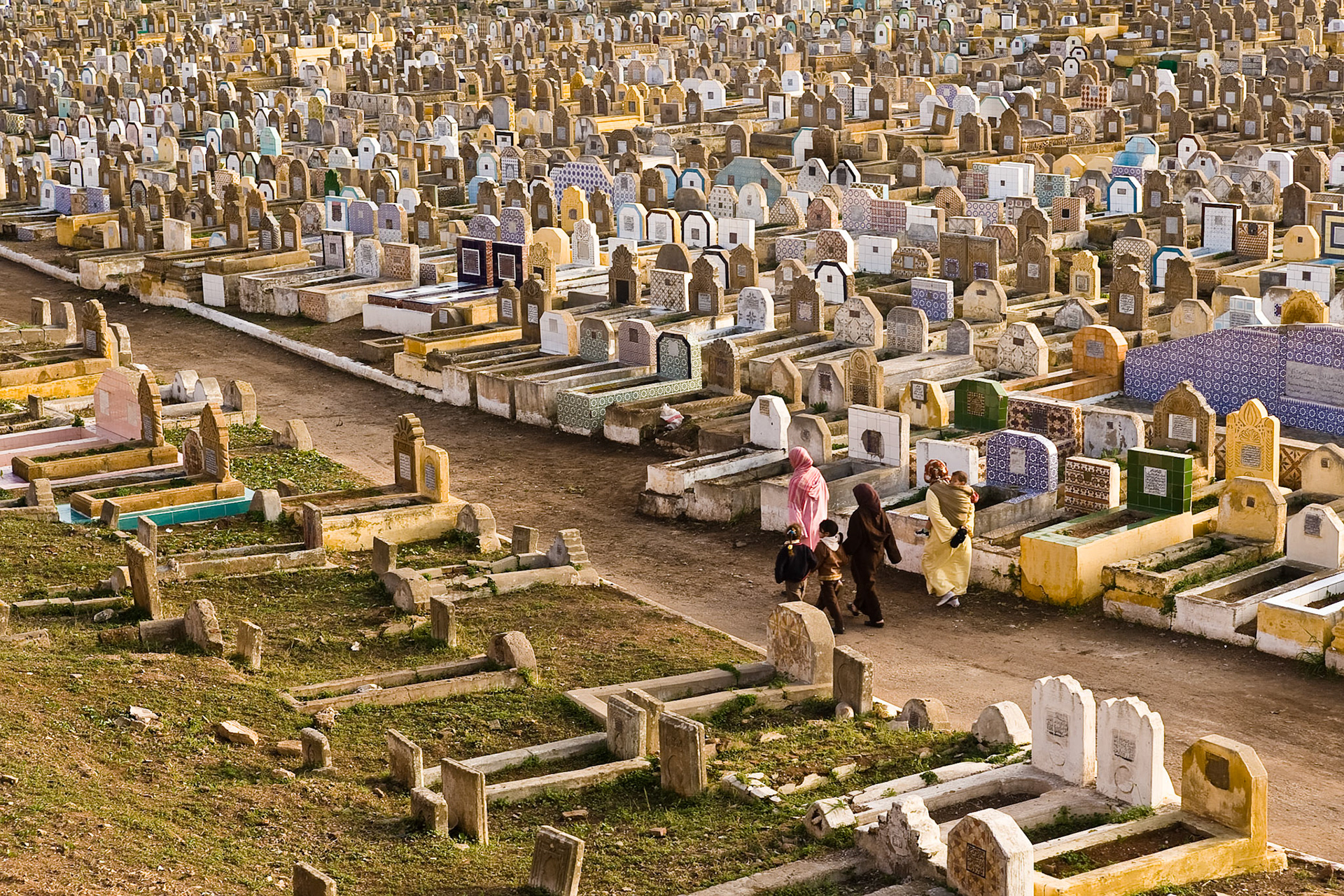 Women with children at Graveyard of Salé near Rabat, Morocco