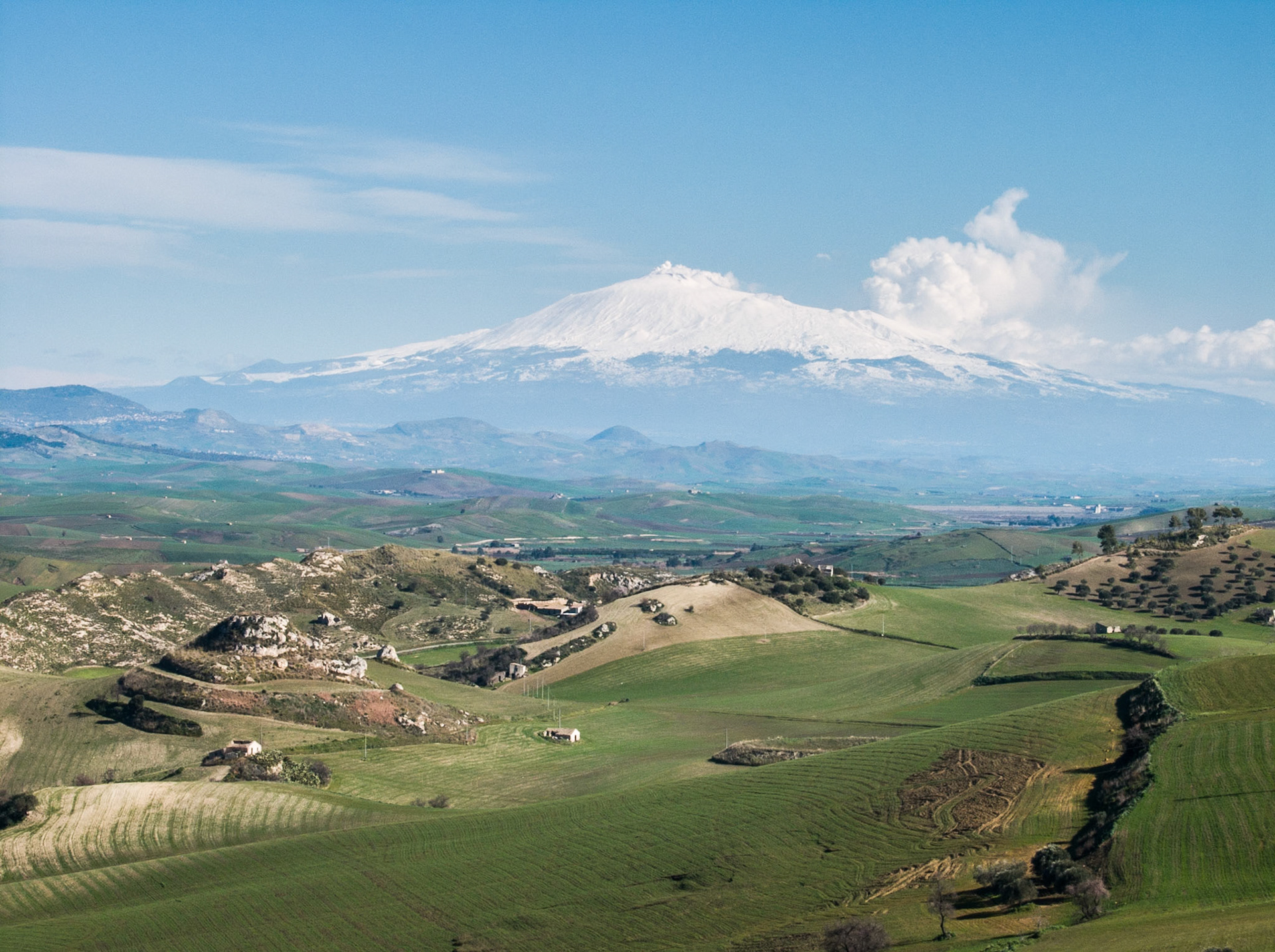 Snow covered vulcano mountain Etna from S124 west of Caltagirone, Sicily, Italy