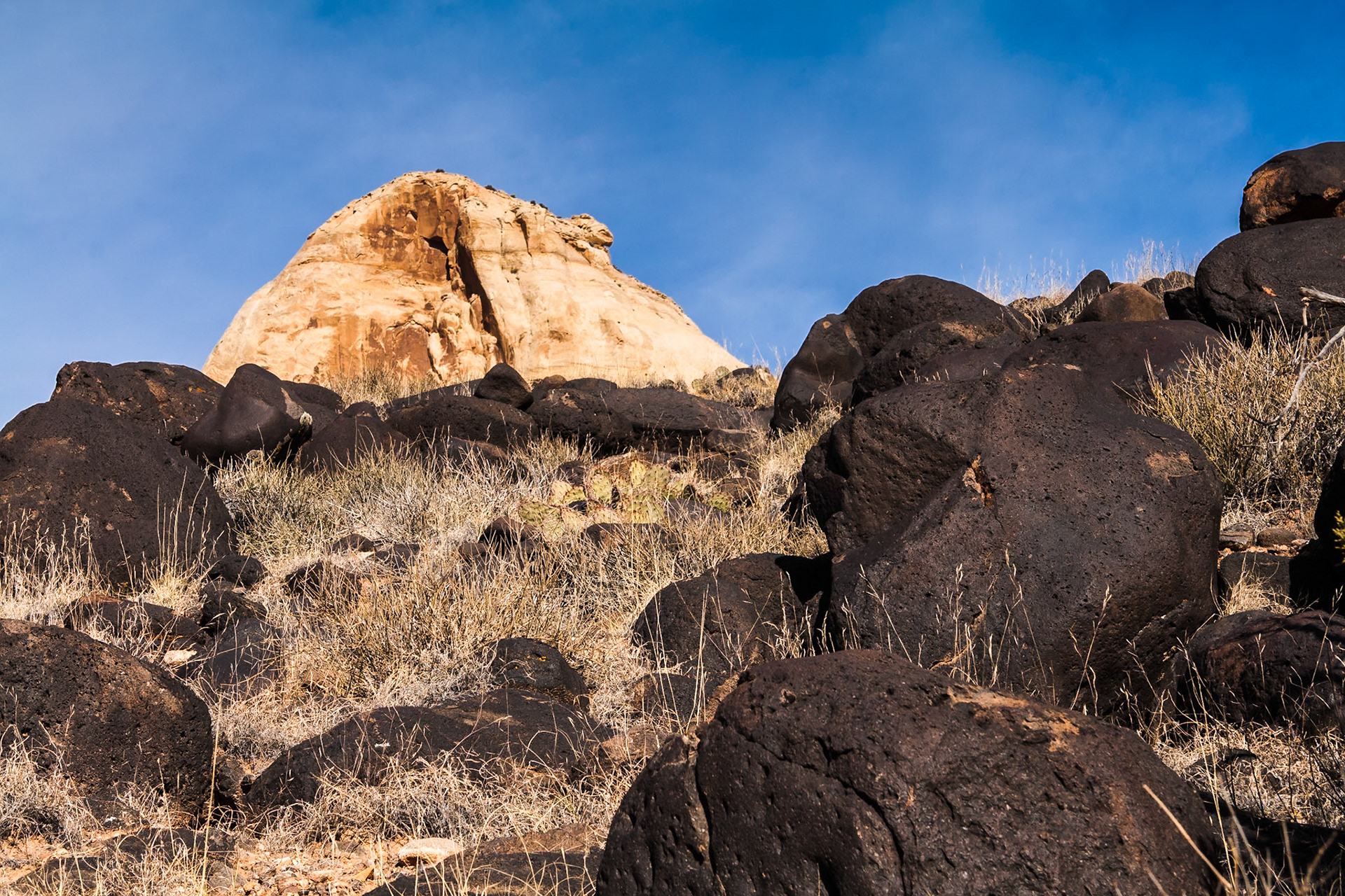 Black bolders at Hickman Natural Bridge trail at Capitol Reef NP, UT, USA