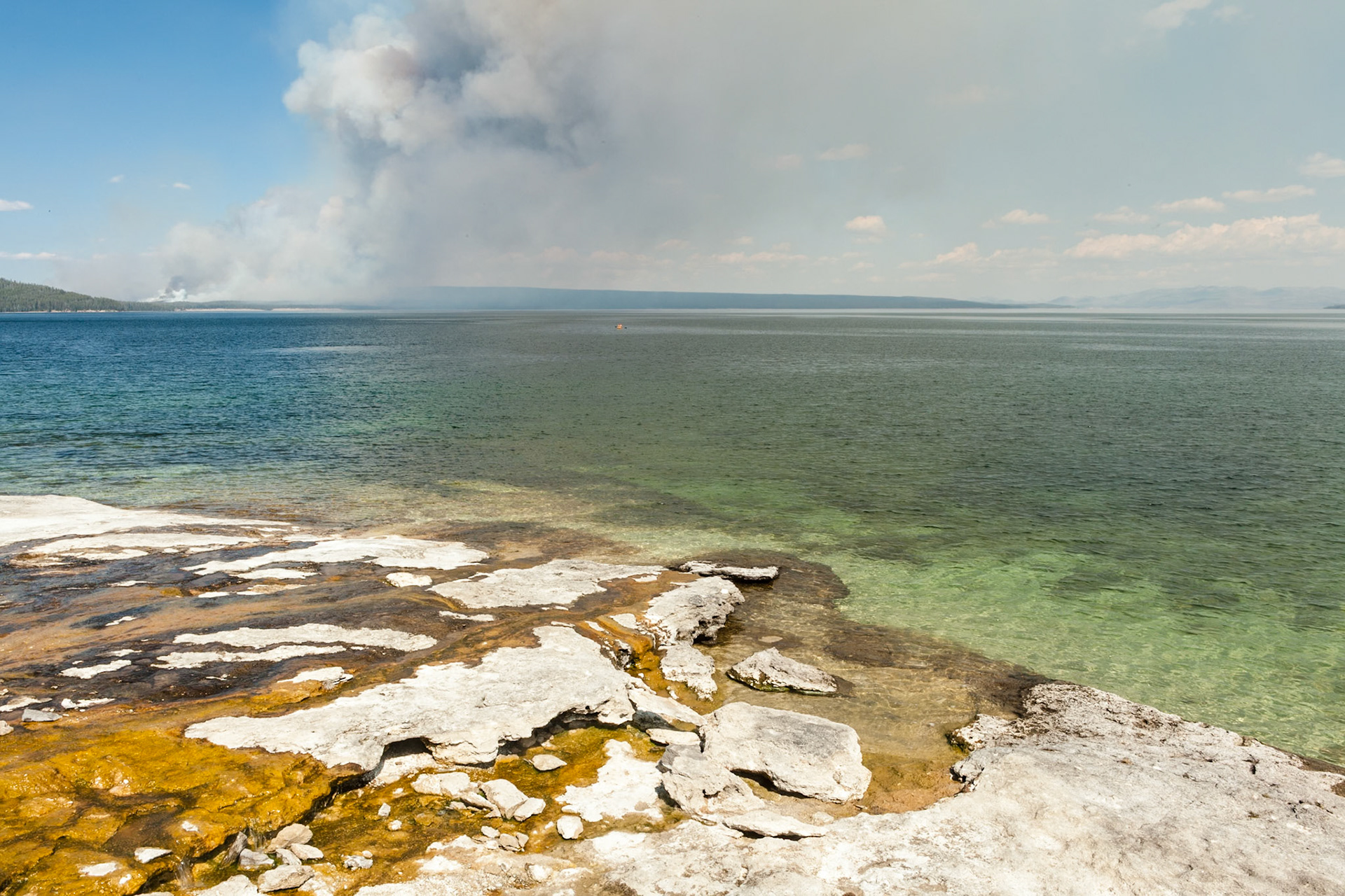 Smoke from forest Fire seen from West Thumb Geyser Basin at Yellowstone Nat'l Park, Wyoming, USA