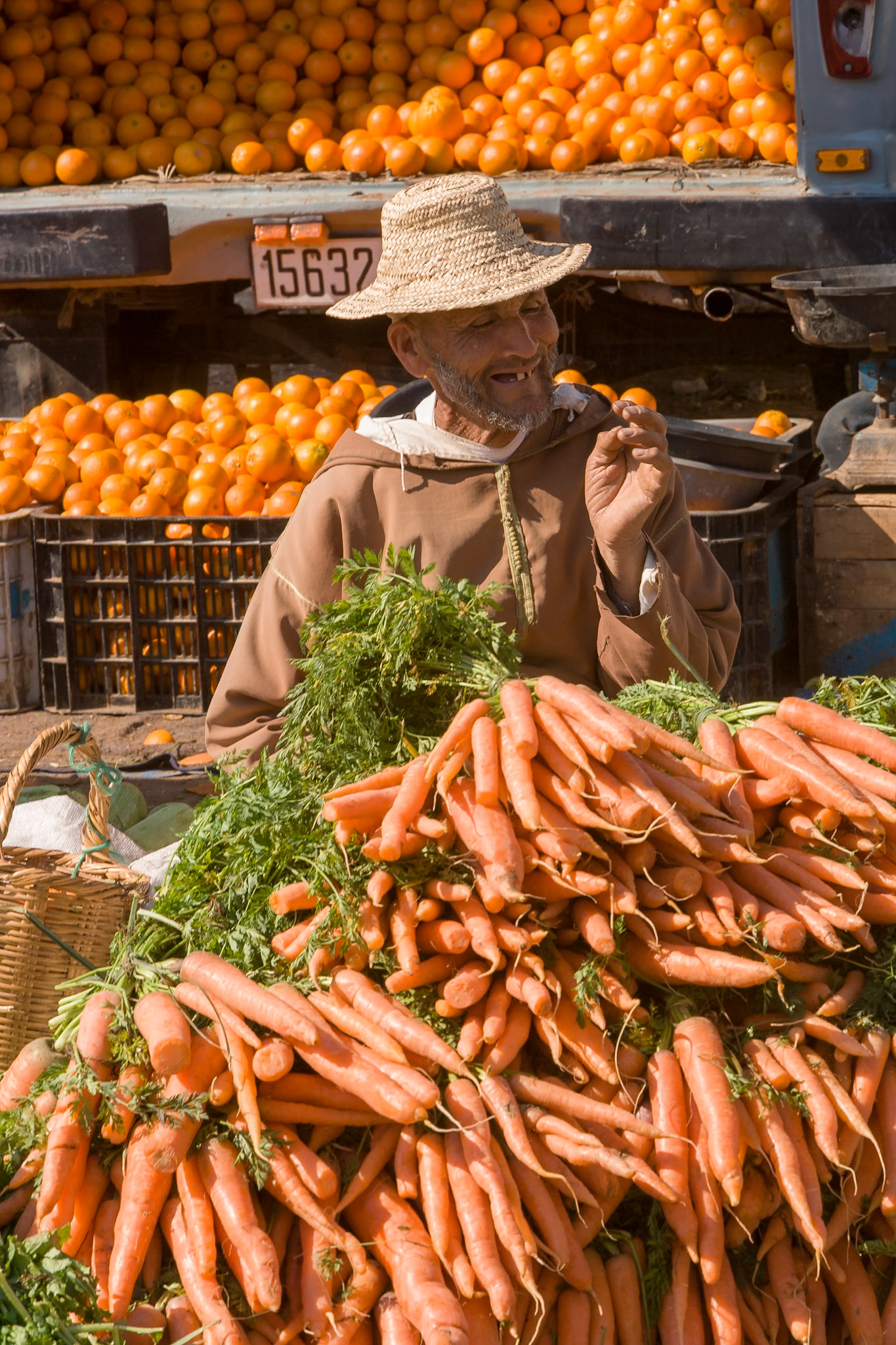Man selling carrots at Market at Ida Ougourd near Essaouira