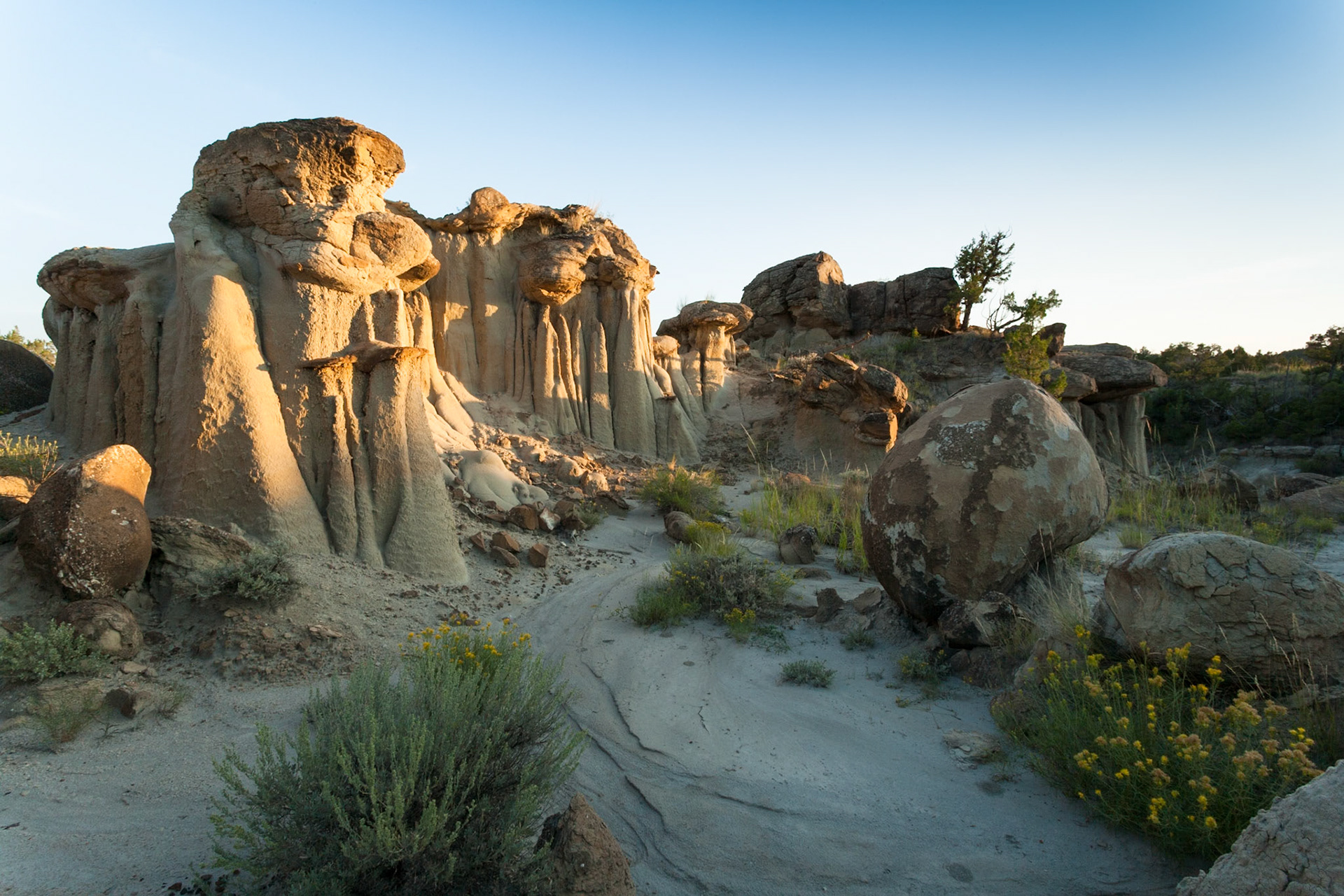 Hoodoos at Makoshika State Park at sunset, Montana, North America, USA