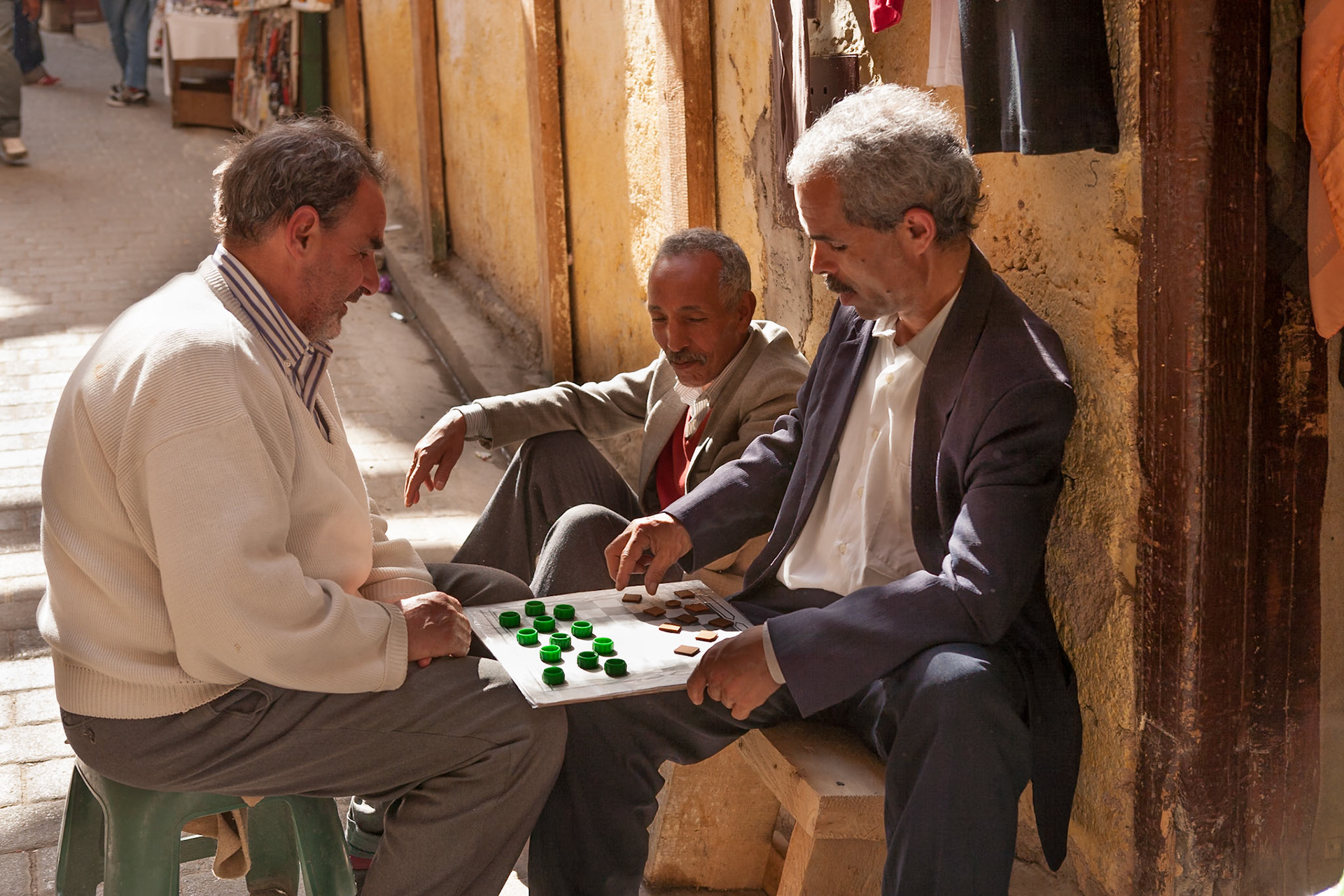 Men playing bord game in the city of Fez