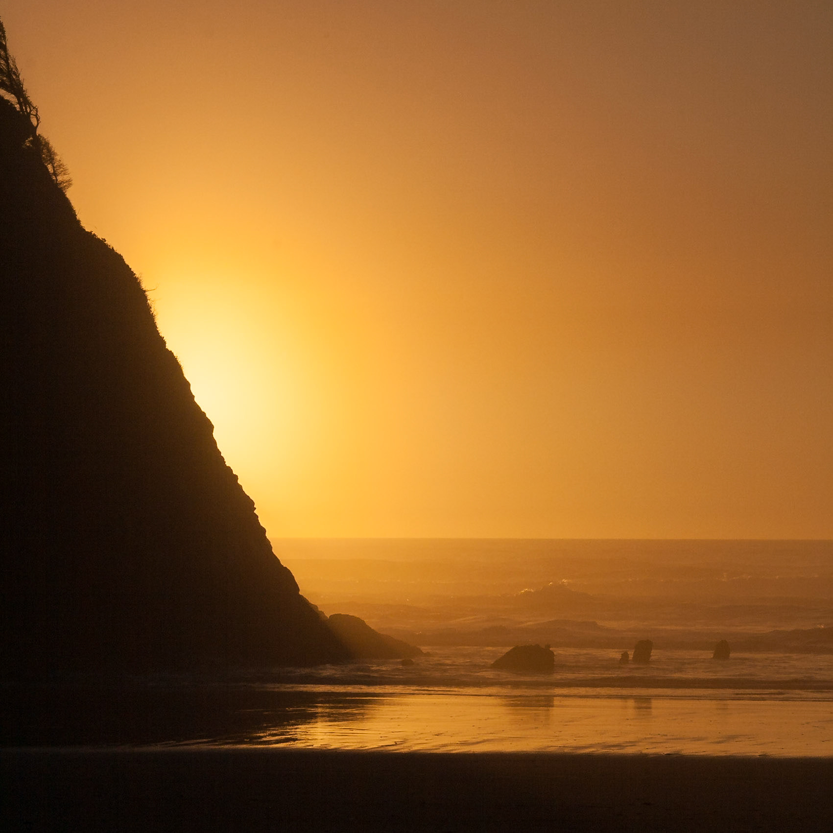 Golden light from Sunset at Proposal Rock at South Beach at Neskowin, OR, USA