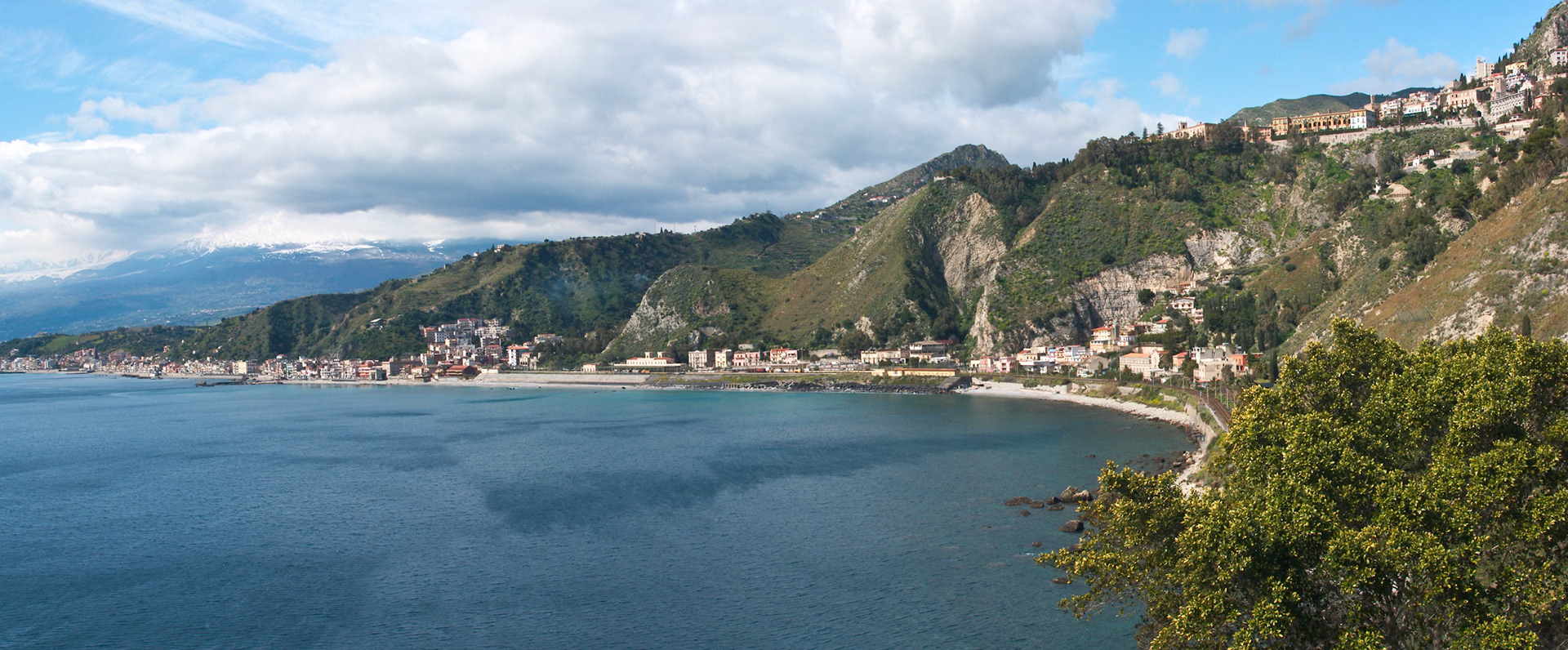 North coast of Taormina Sicily direction Etna at the mediterranium sea. Panorama. Sicily, Italy