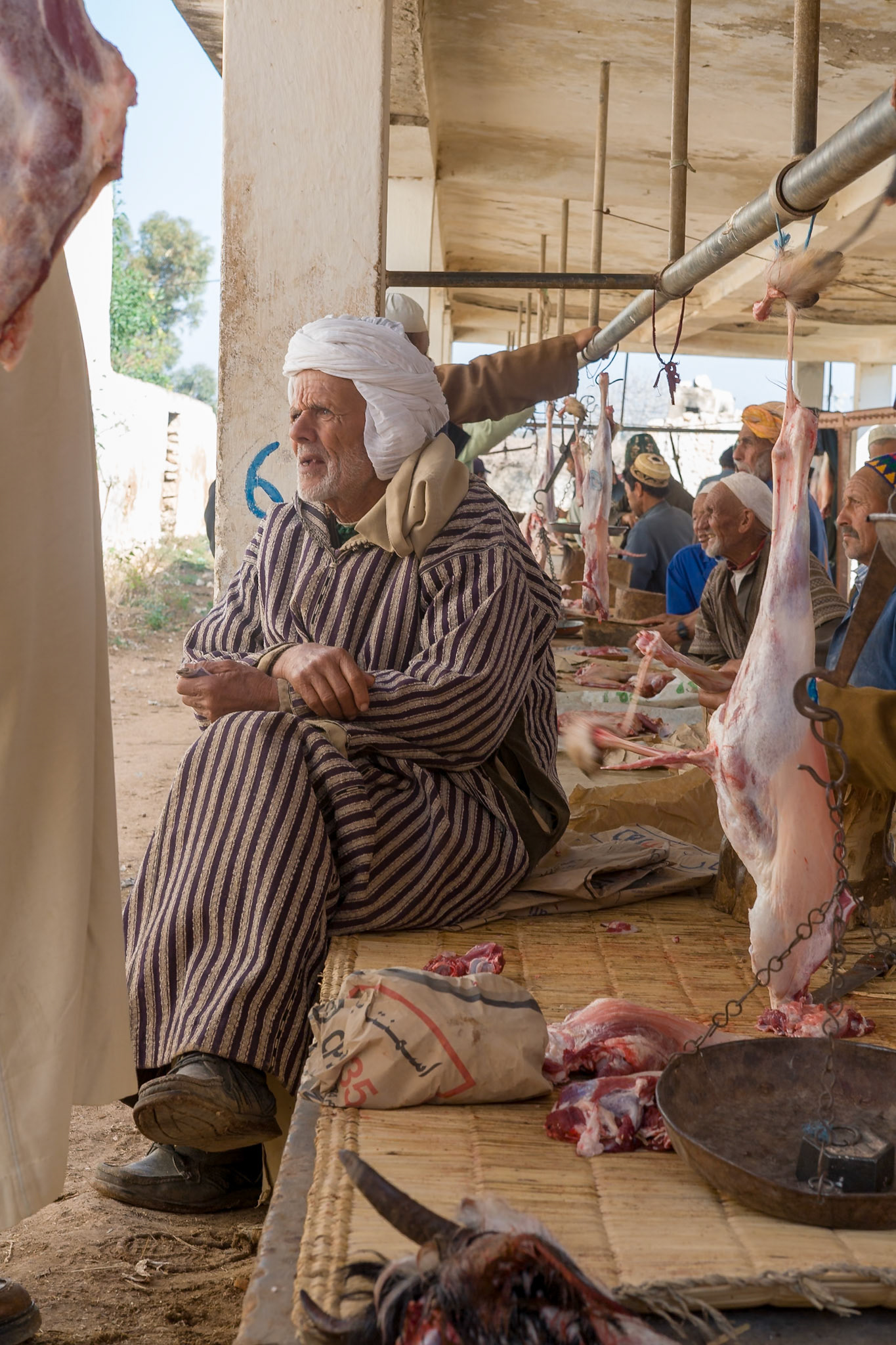 AFRICA, MOROCCO, PRButchers and customars at Market at Ida Ougourd near Essaouira