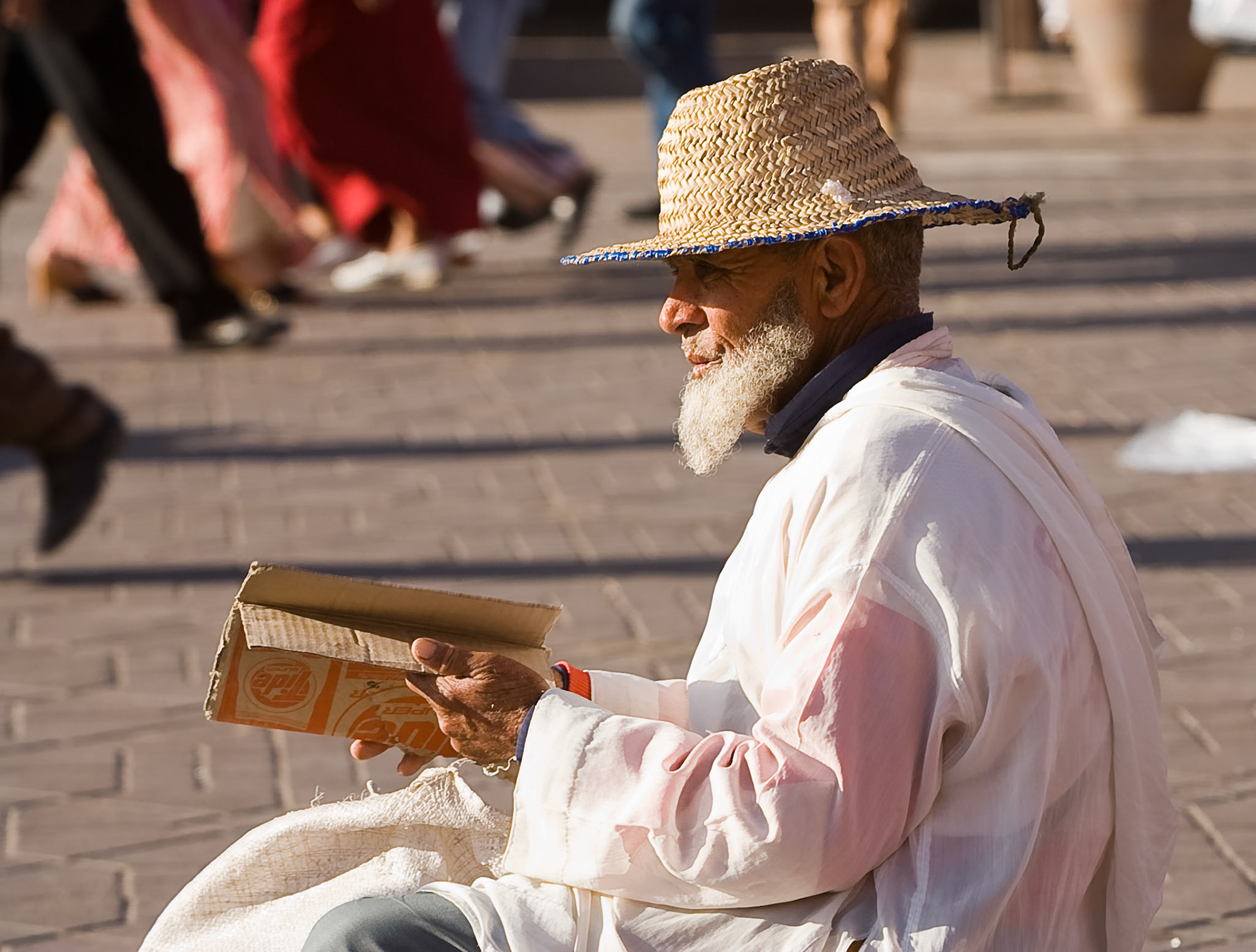 Man sitting at Place Djamaa el Fna at the city of  Marrakech