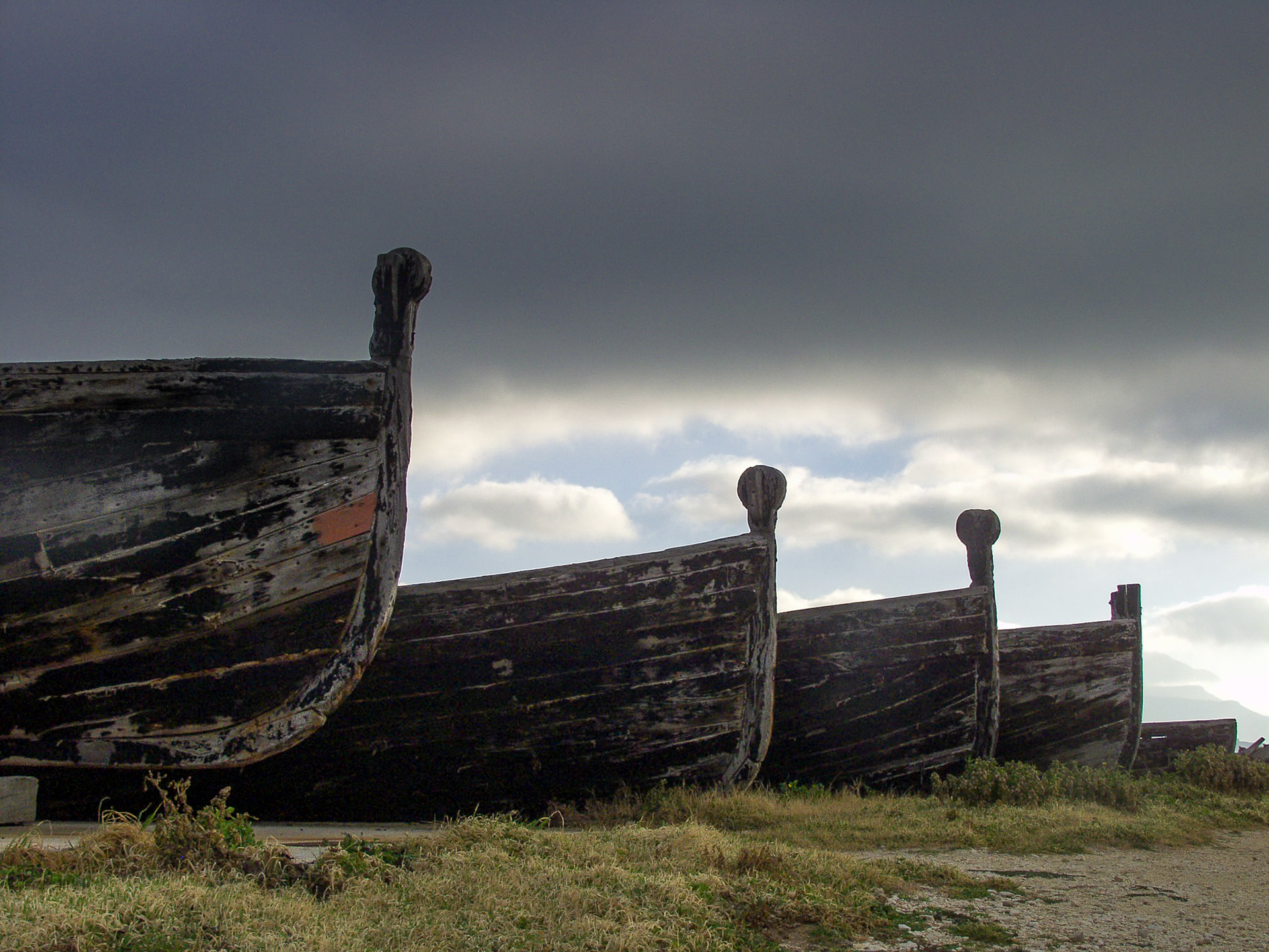 Dramatic sky above Old Boats at Tonnaro Bonagio, Sicily, Italy