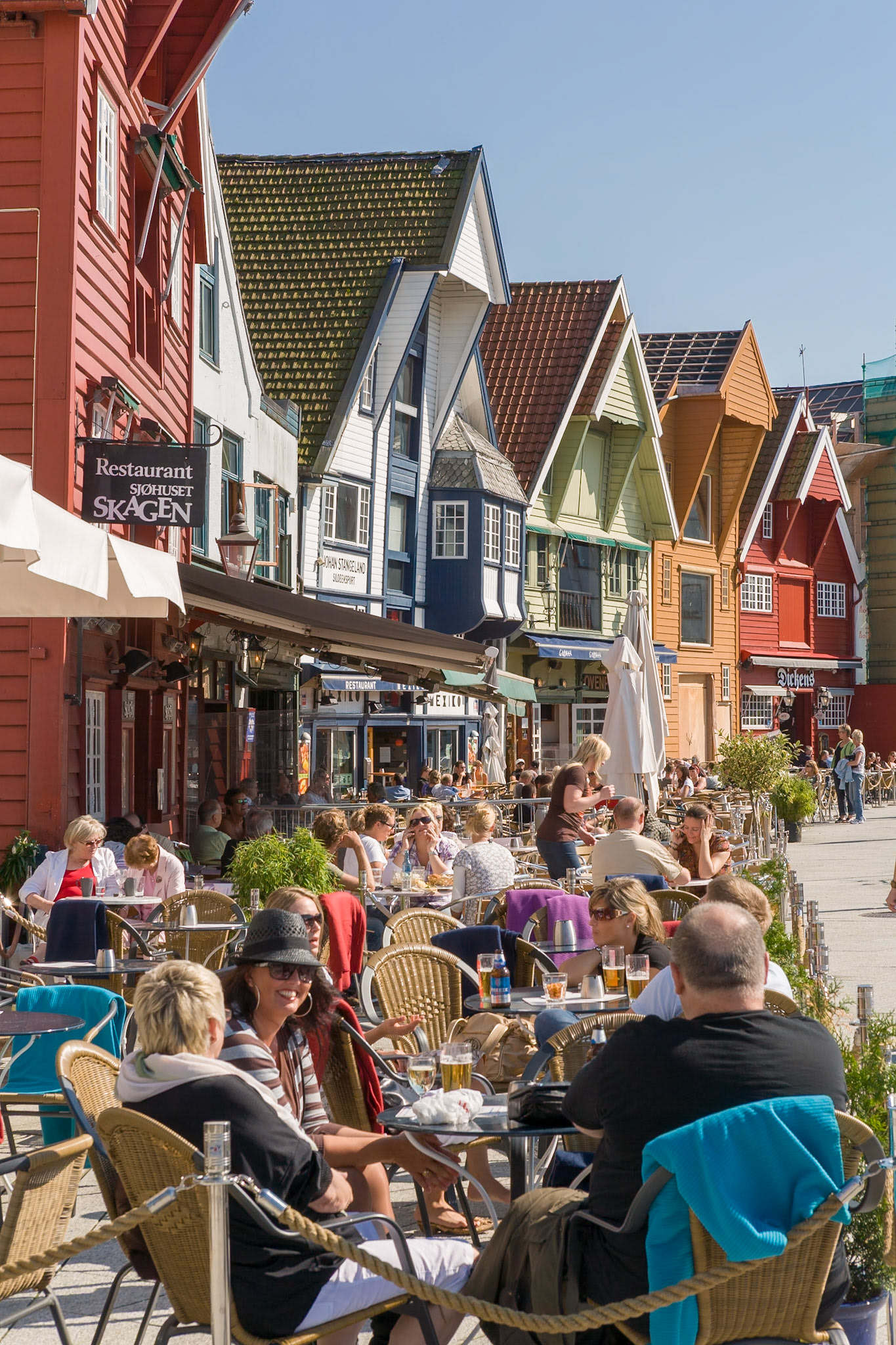 NORWAY, COUNTY VEST-AGDER-DISTRICT LISTER, -CIRCA AUG 2007 - Colored houses and restautants with sidewalk café at the harbor area at the city of Stavanger