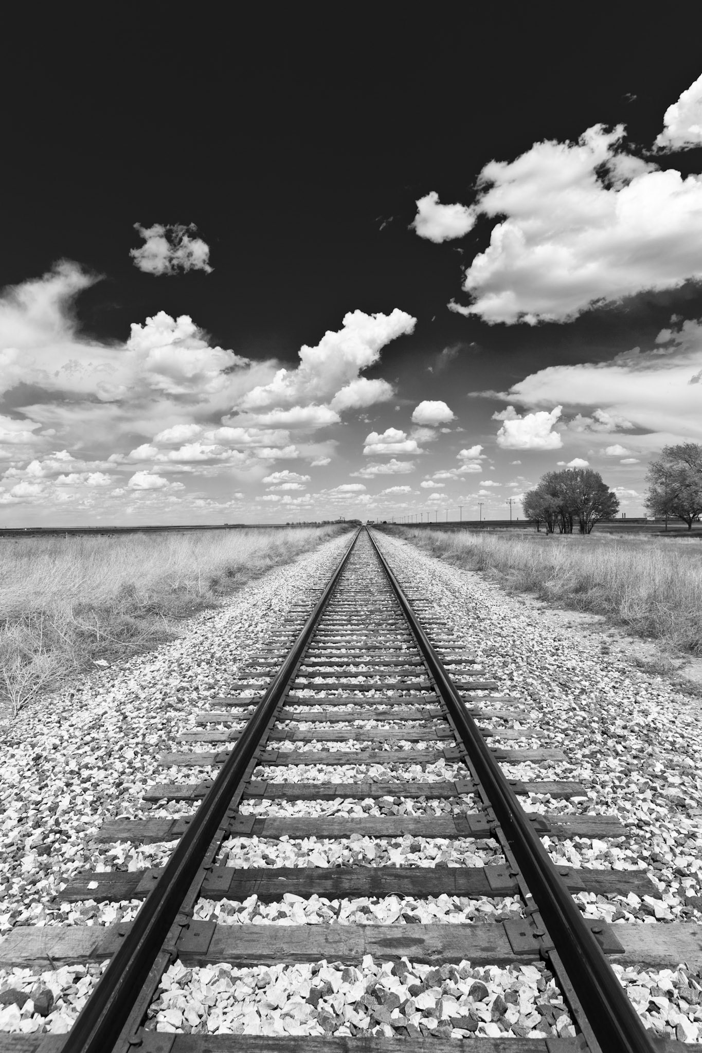 Rail Road and Clouds in a blue Sky in New Mexico,  Lack of aesthetic or commercial appeal