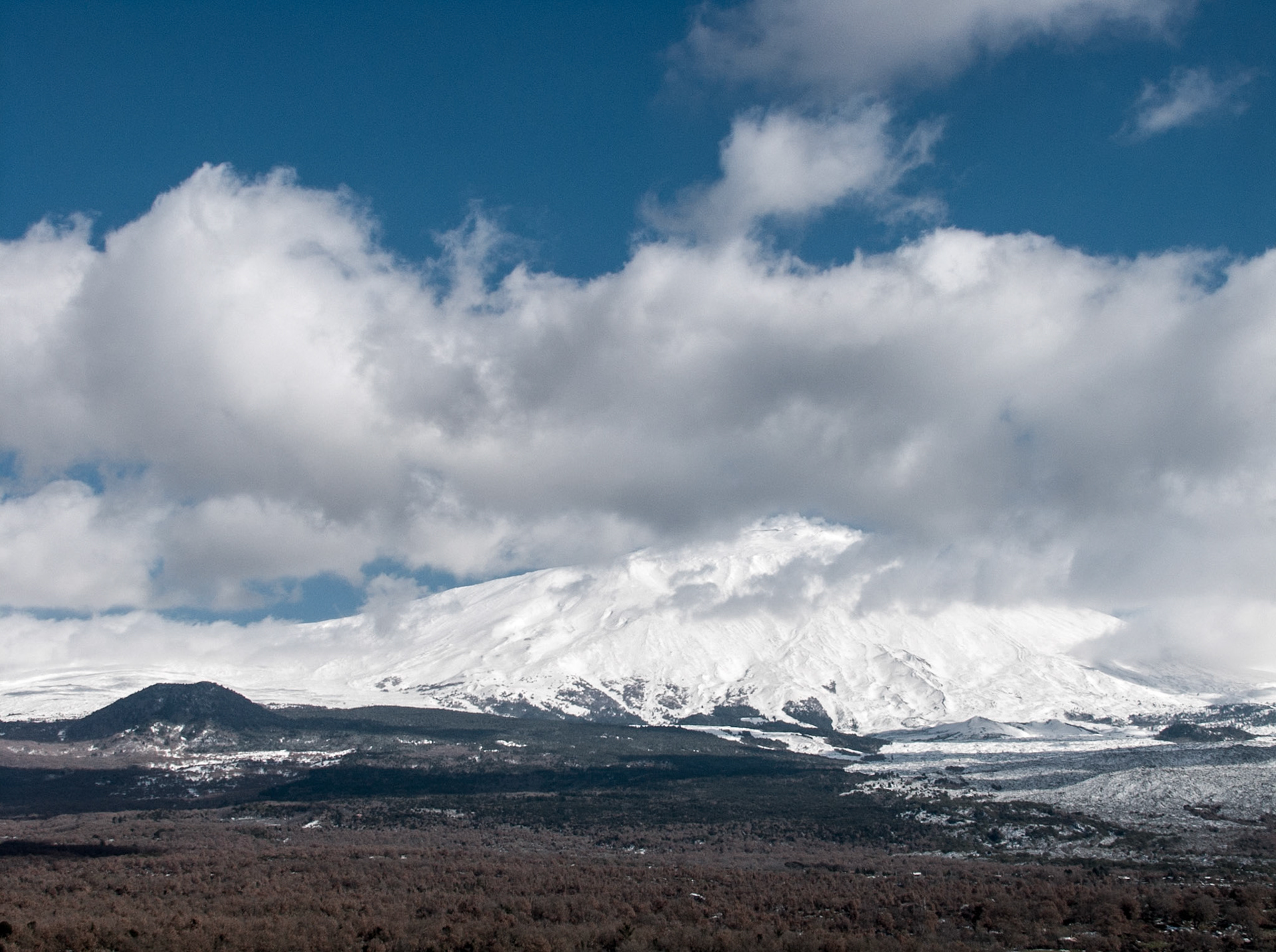 The snow covered vulcano mountain Etna from the West side at Sicily, Italy