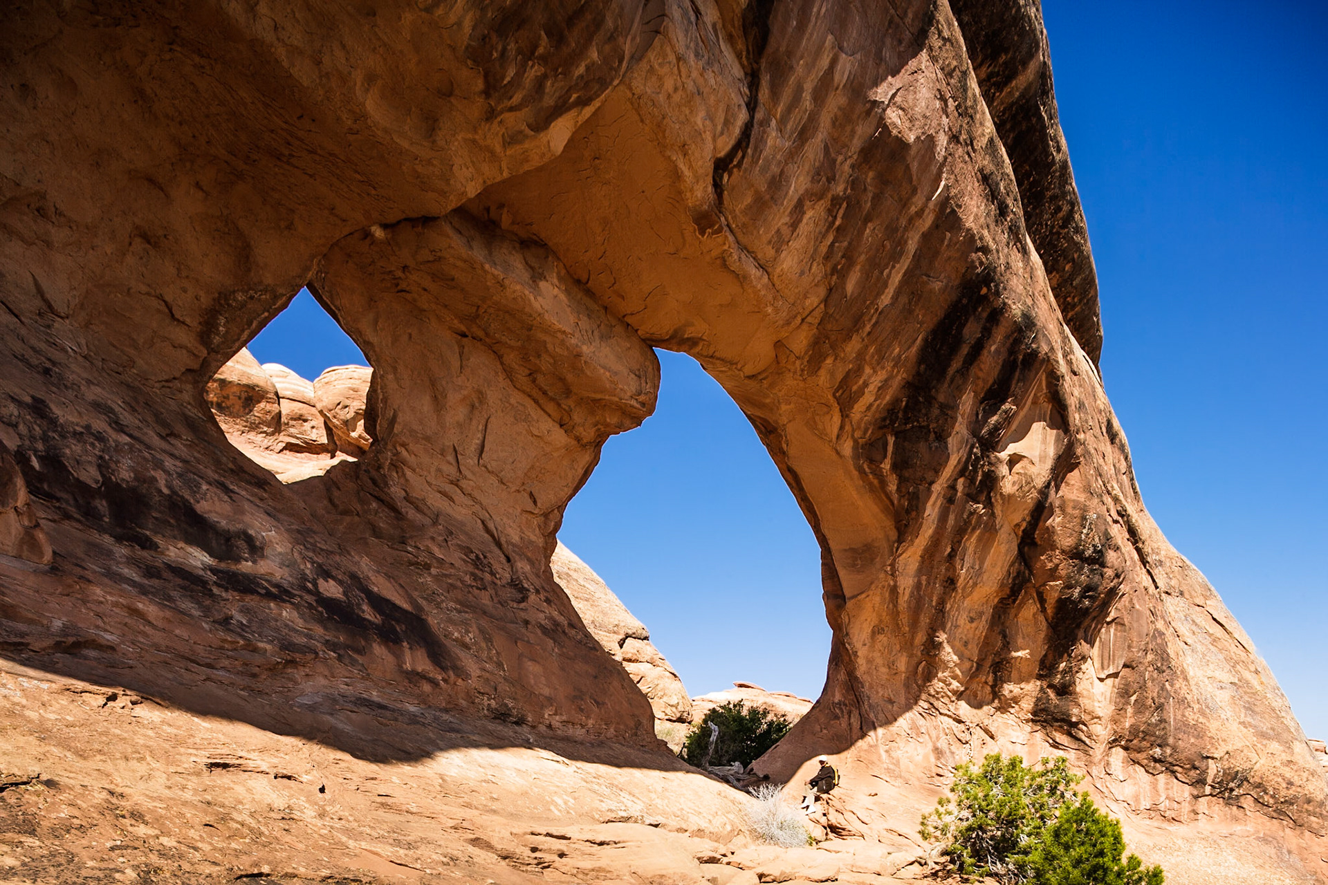 Woman at Partition Arch, Arches national Park, Utah, USA