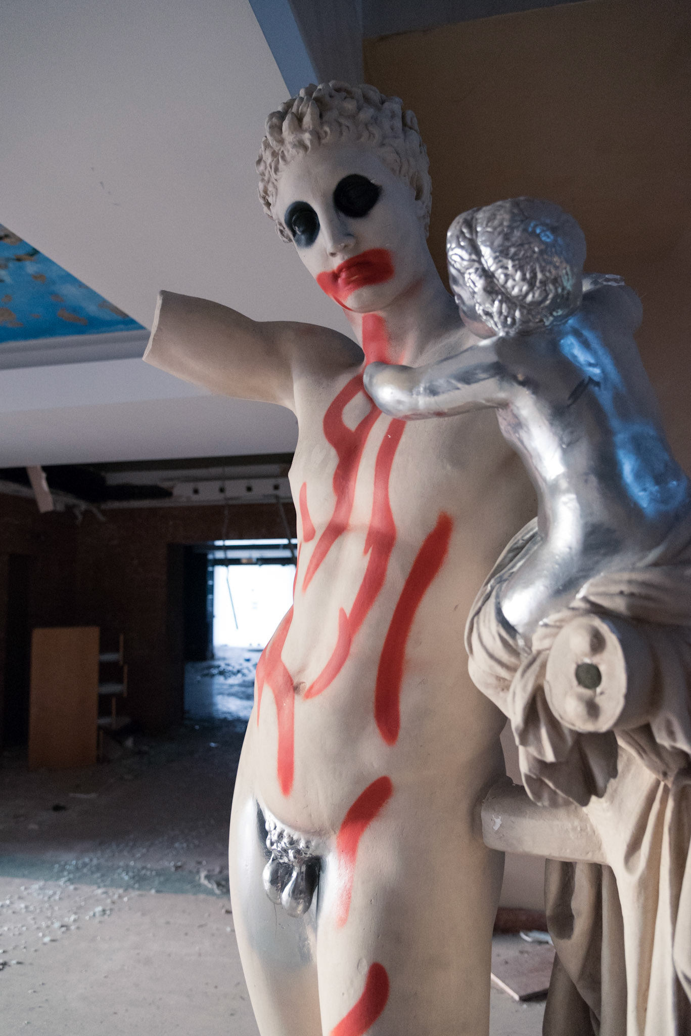 A defaced replica statue of the  Hermes of Praxiteles found in the first floor of the abandoned hotel