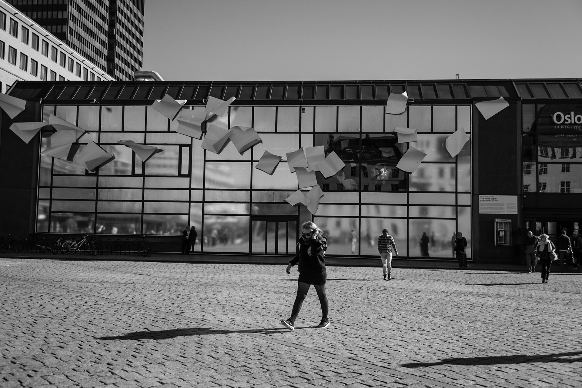 People walking in front of the Oslo Central Station in Oslo, Norway