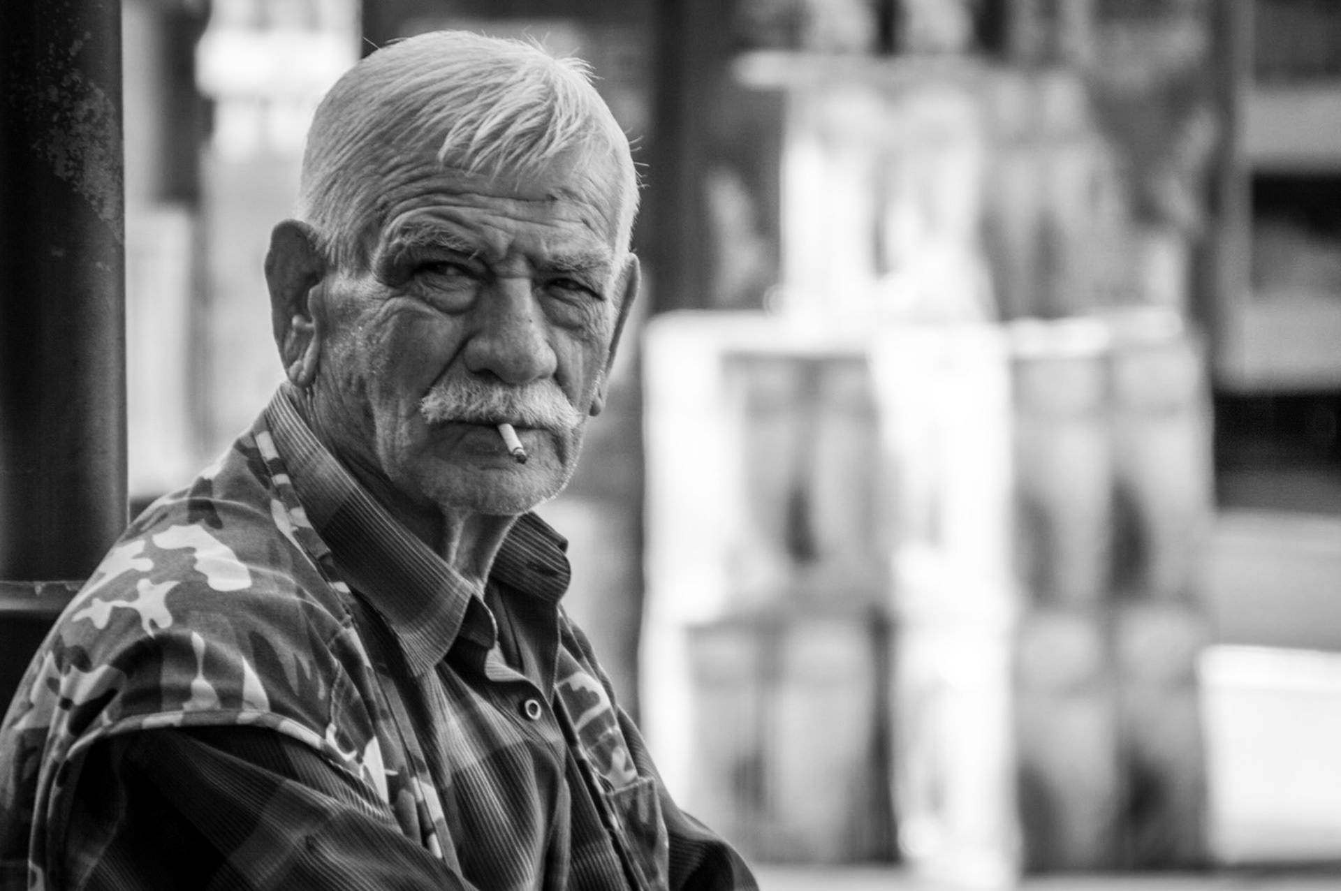 Old man smoking outside the yard of the Selimiye Mosque in Occupied Nicosia, Cyprus