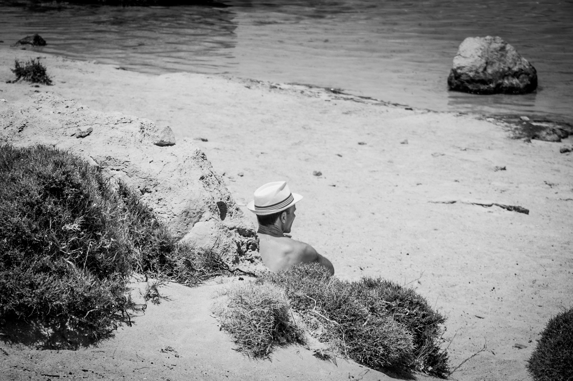 A man sunbathing at Balos beach in Chania, Crete in Greece