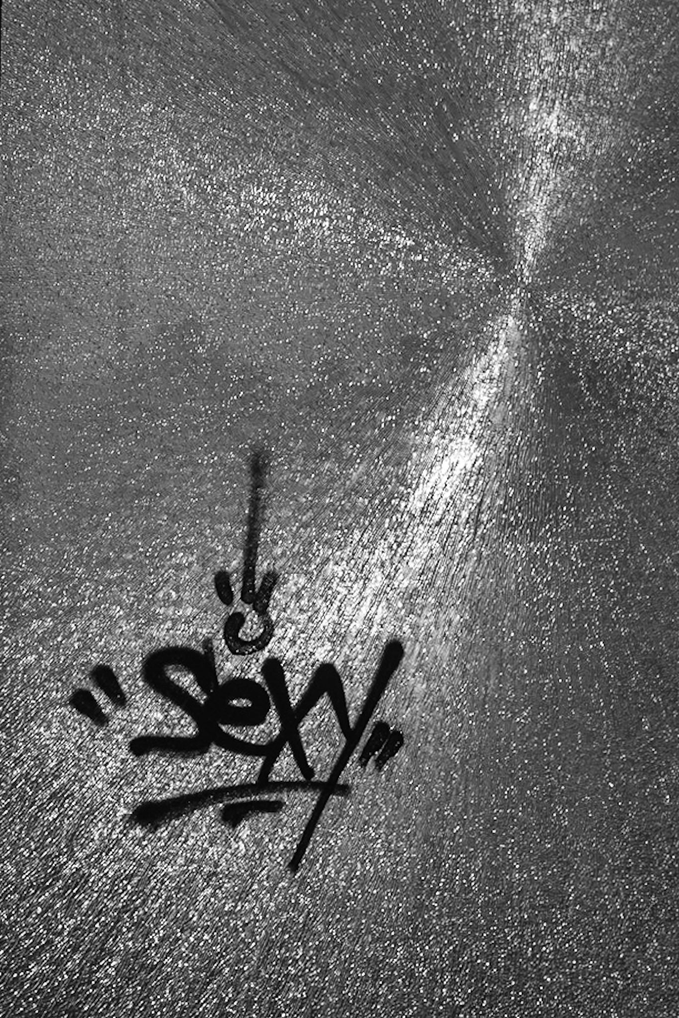 Street art on a broken glass in an abandoned hotel in Nicosia, Cyprus