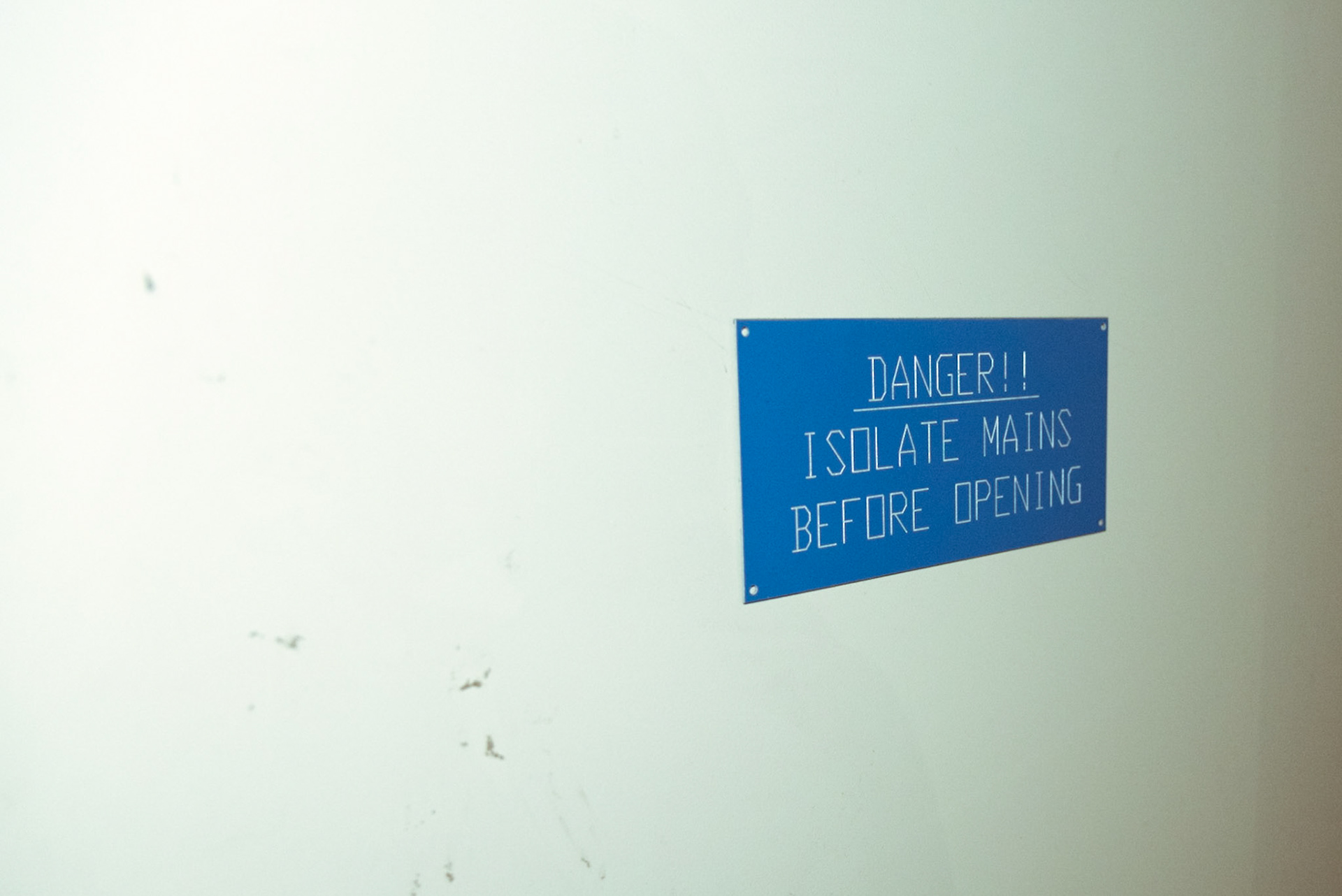 A warning on a door in the basement of the abandoned hotel