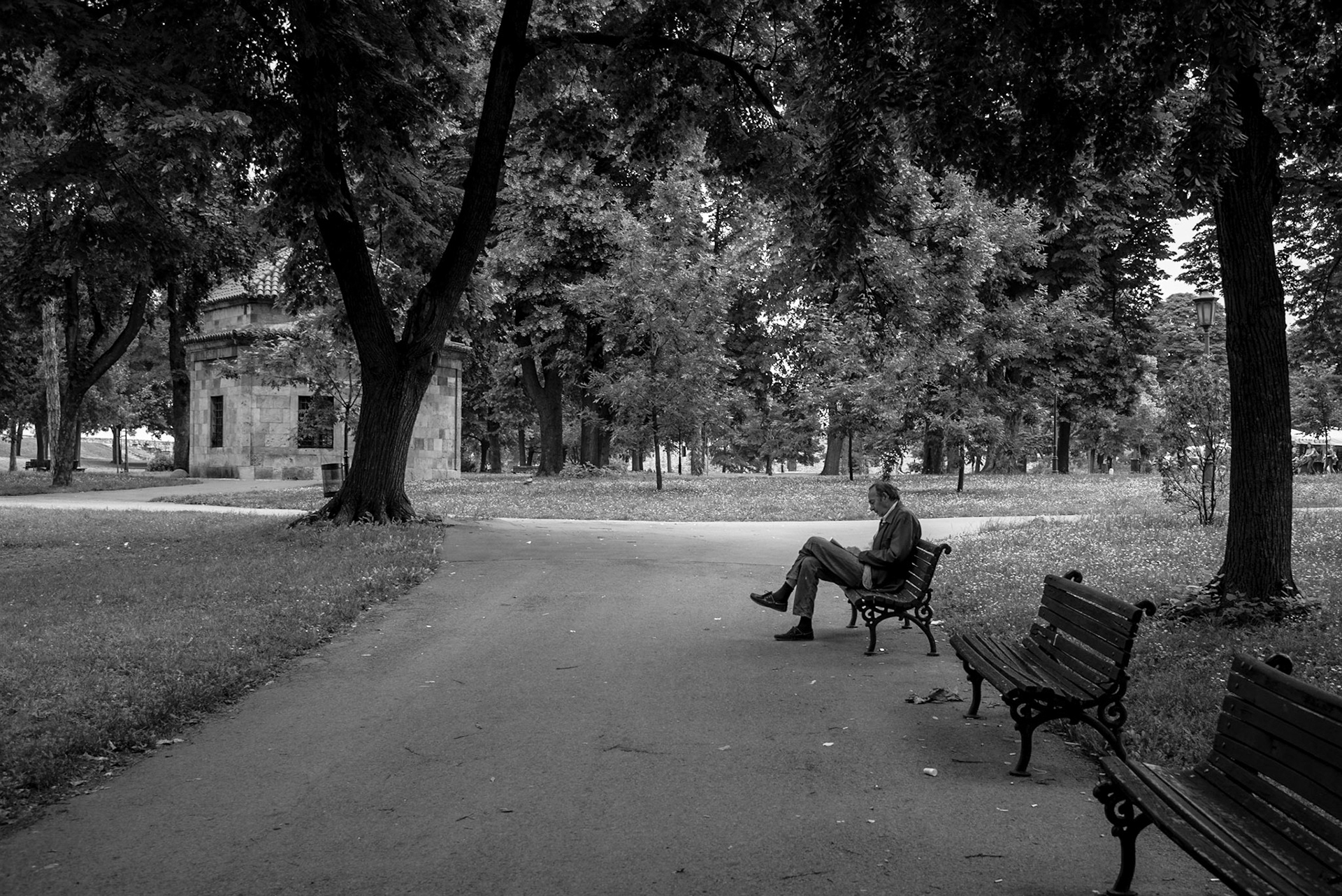 Man reading newspaper in Kalemegdan Park in Belgrade, Serbia