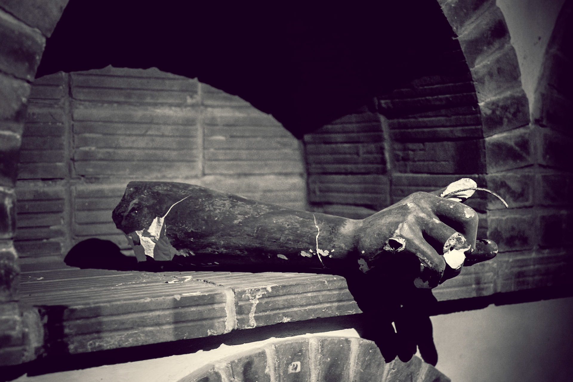 This arm from a broken statue was in a pitch black room at the basement of the building. As soon as the flashlight lit I got scared as hell ;)