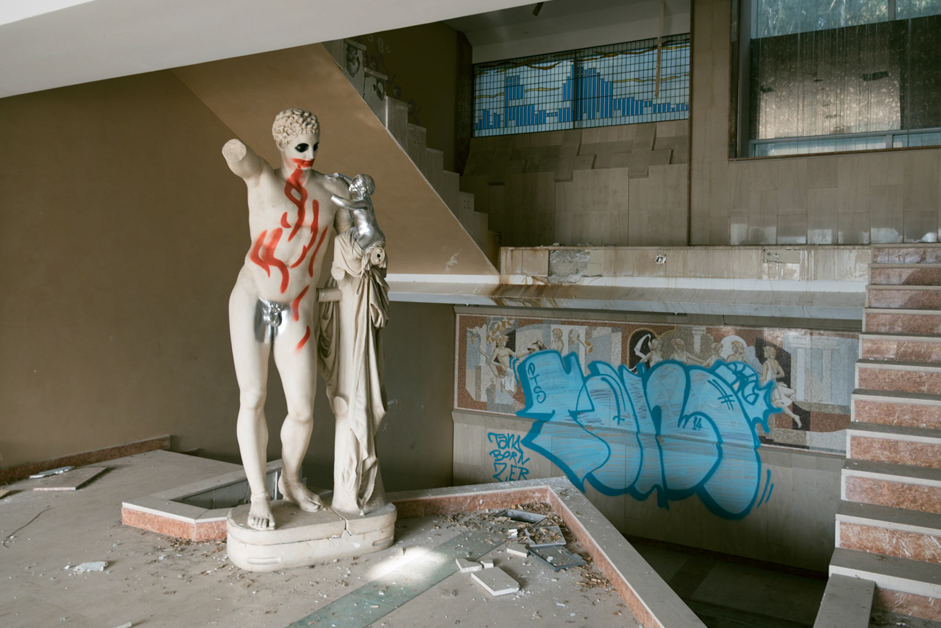 A defaced replica statue of the  Hermes of Praxiteles found in the first floor of the abandoned hotel