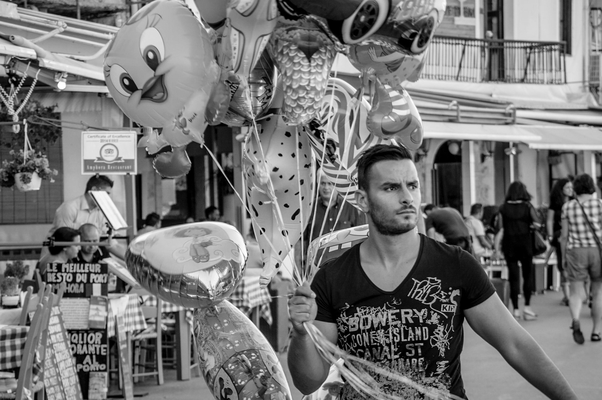 Man selling balloons at Chania Port in Crete, Greece