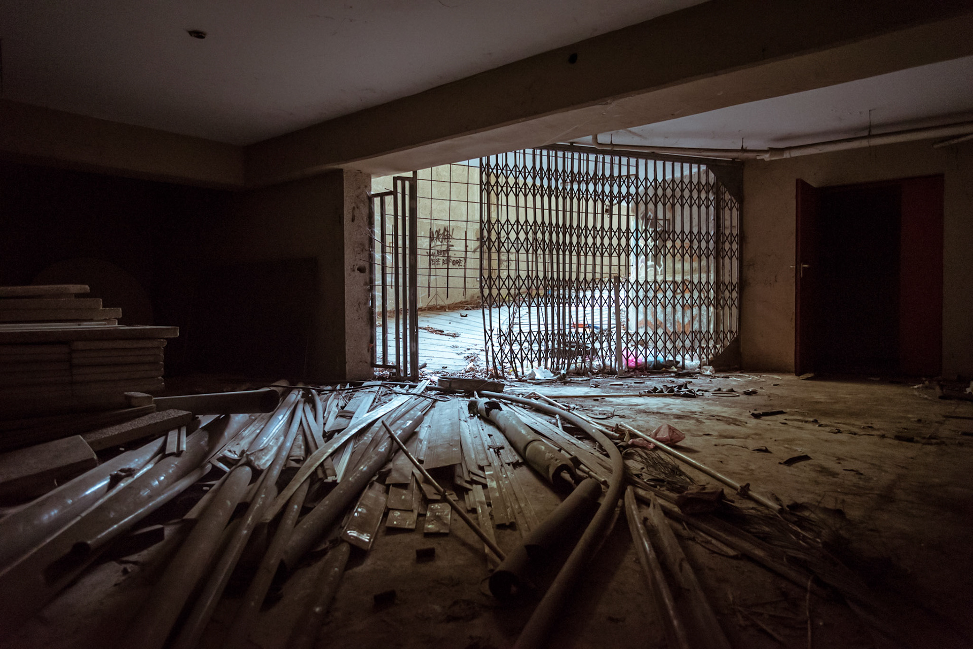 Pipes scattered all over the place at the entrance of the basement from the car park