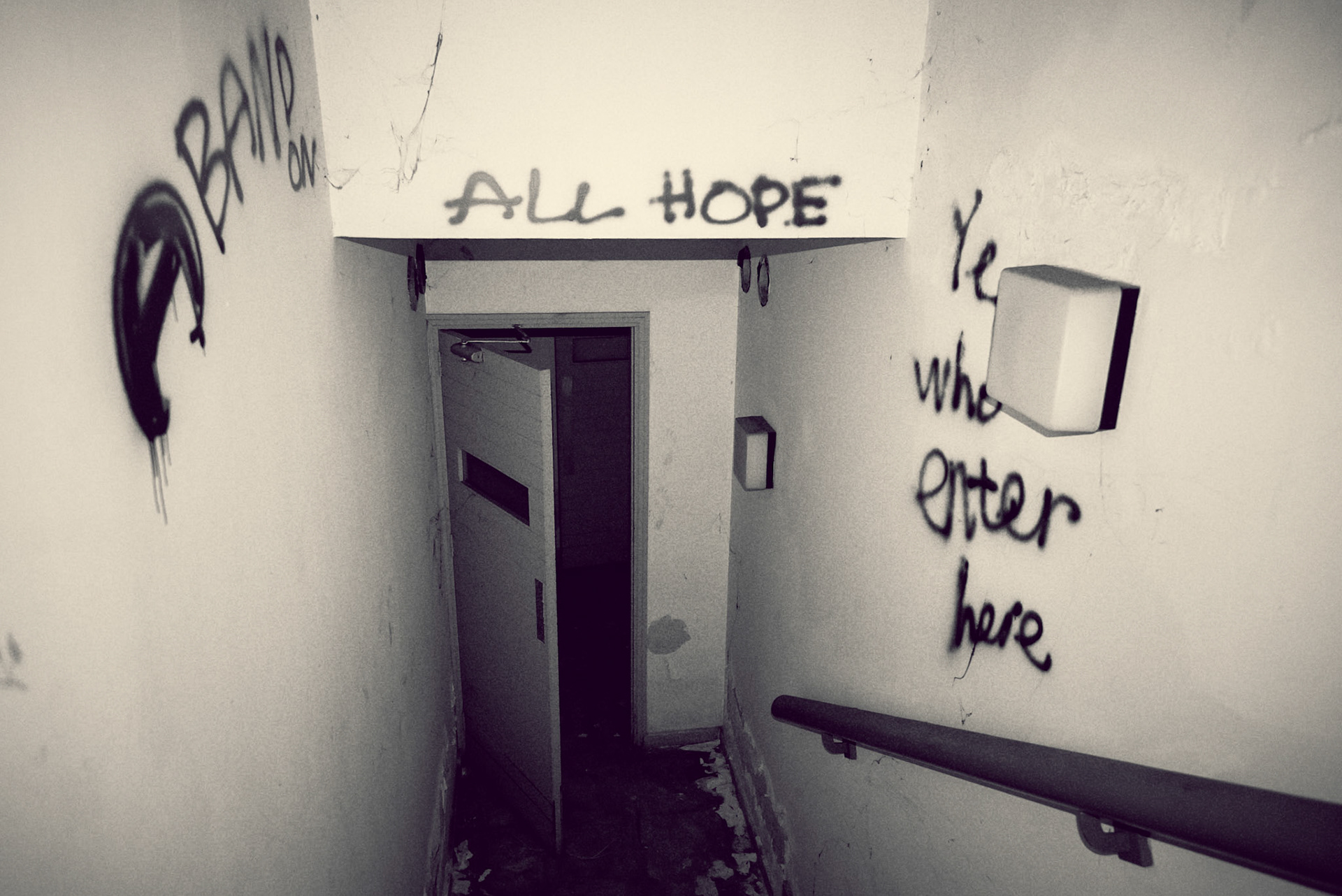 A warning is written on the walls of the basement entrance