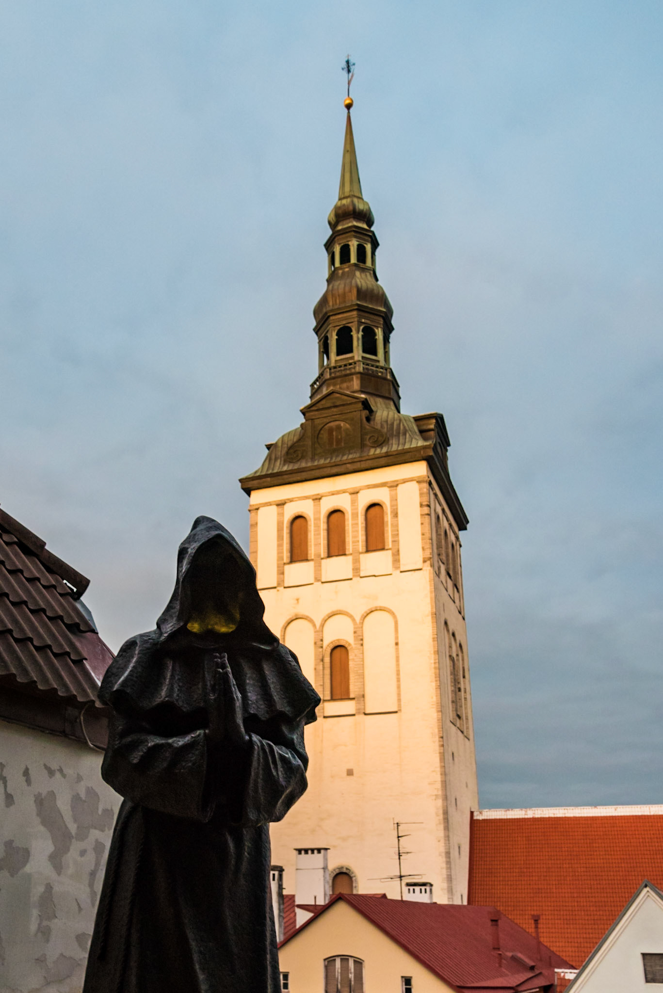 Monk Statue and St. Nicholas Church in Tallinn, Estonia