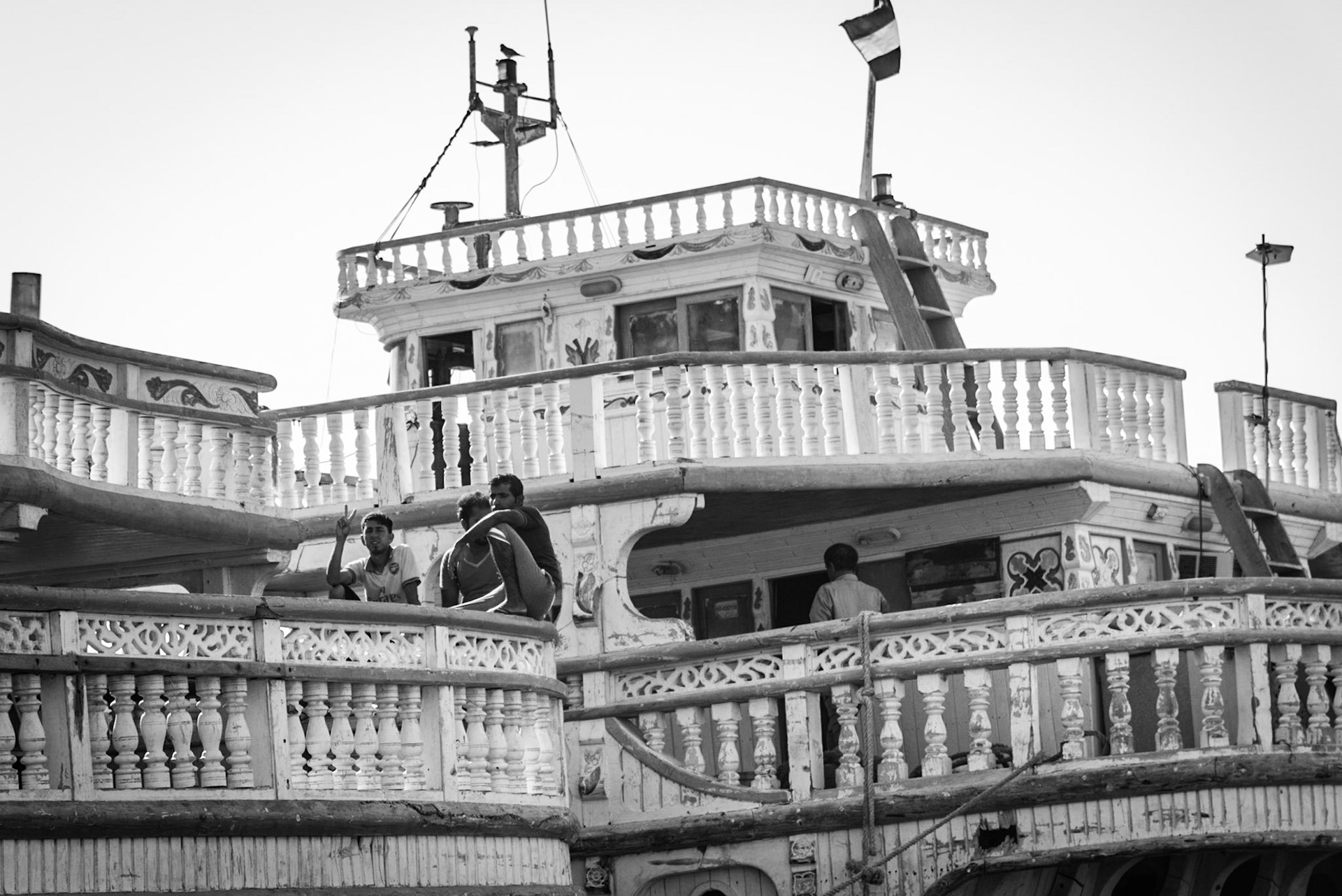 Dhow crew members taking a break in Dubai Creek, UAE