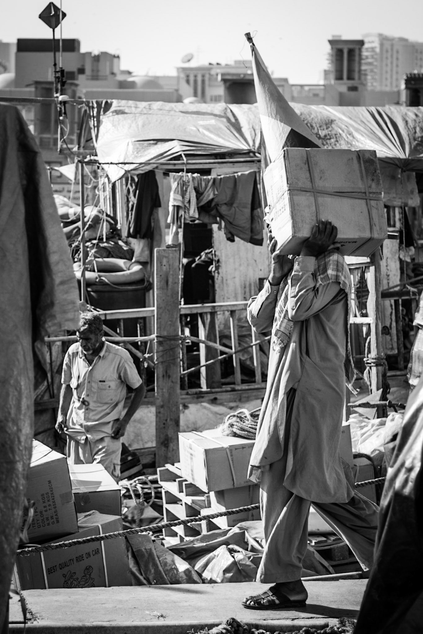 Workers unloading a dhow in Dubai Creek, UAE