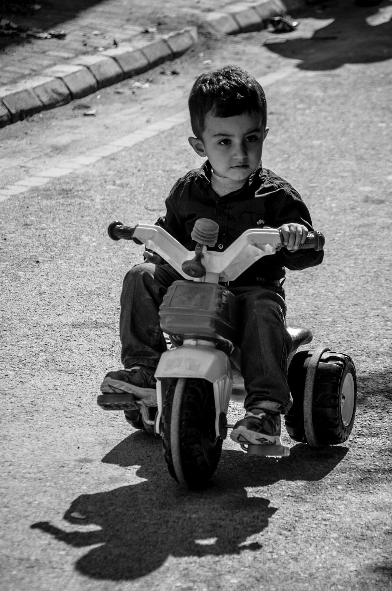 Little kid riding a bike near the buffer zone in Occupied Nicosia, Cyprus