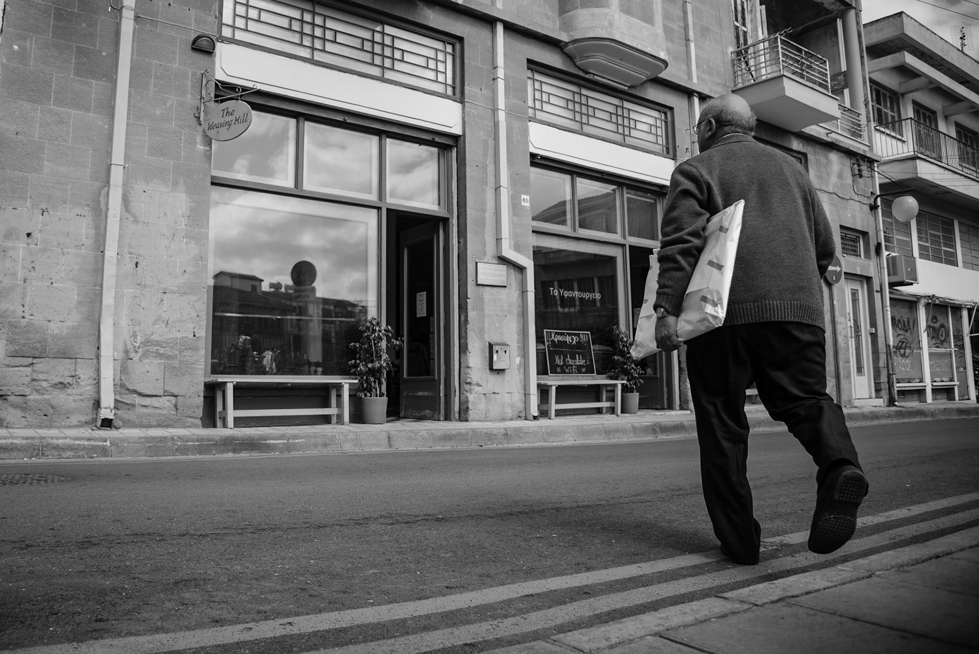 Old man crossing the street in Old Nicosia, Cyprus