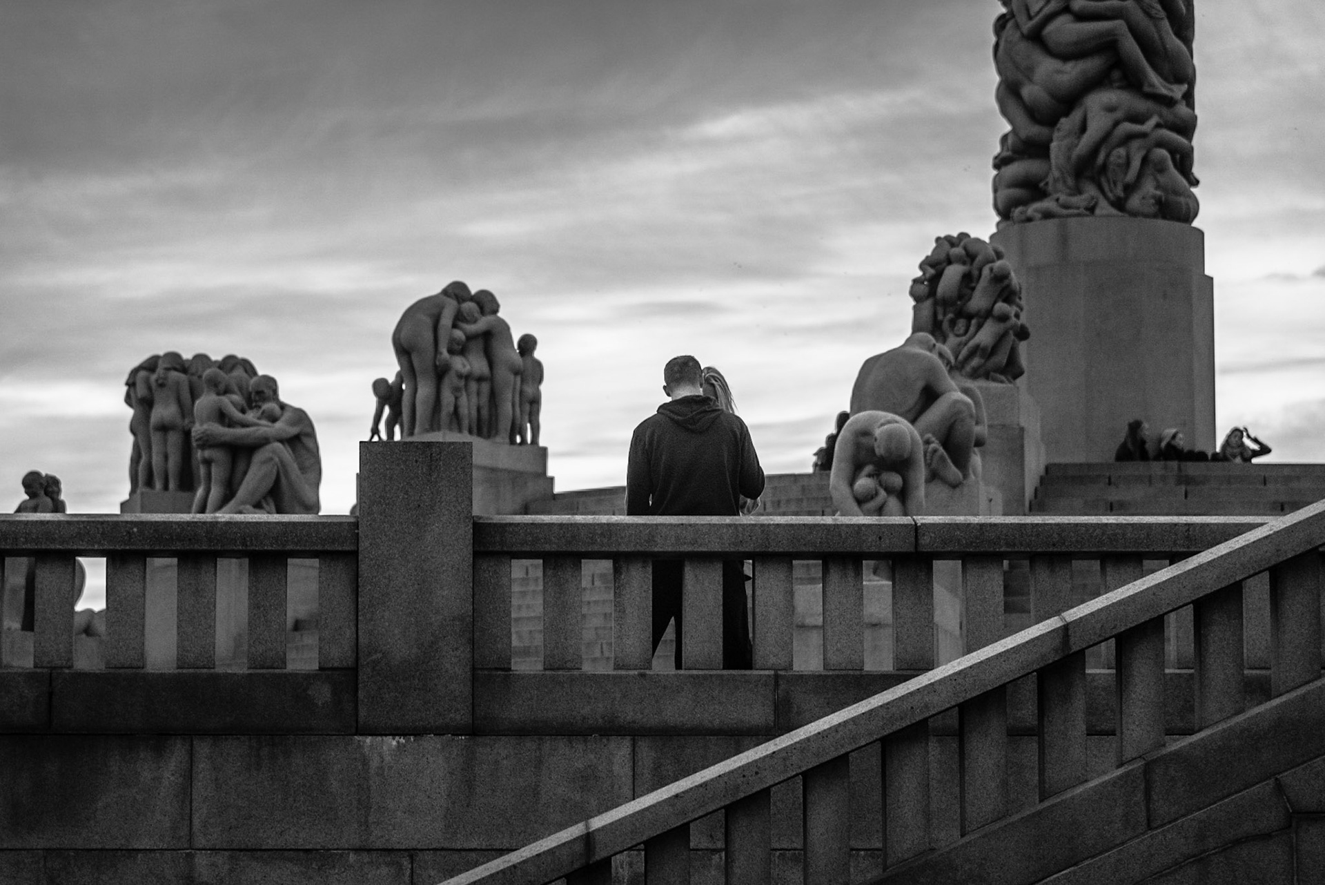 A couple near the Monolith at the Vigeland Park in Oslo, Norway