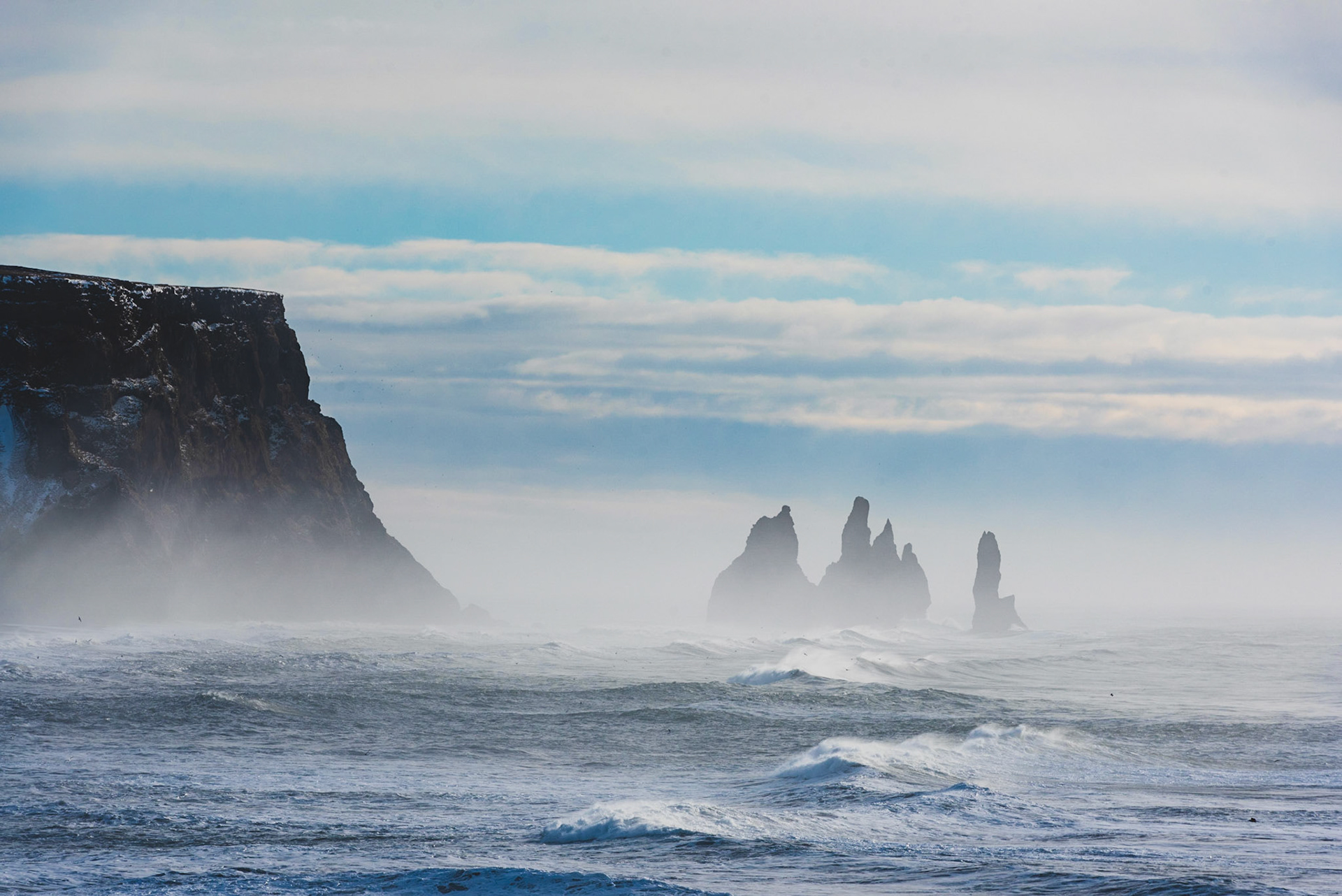 Close up view of the Reynisfjara Beach's  basalt pillars from a high viewpoint near Dyrholaey