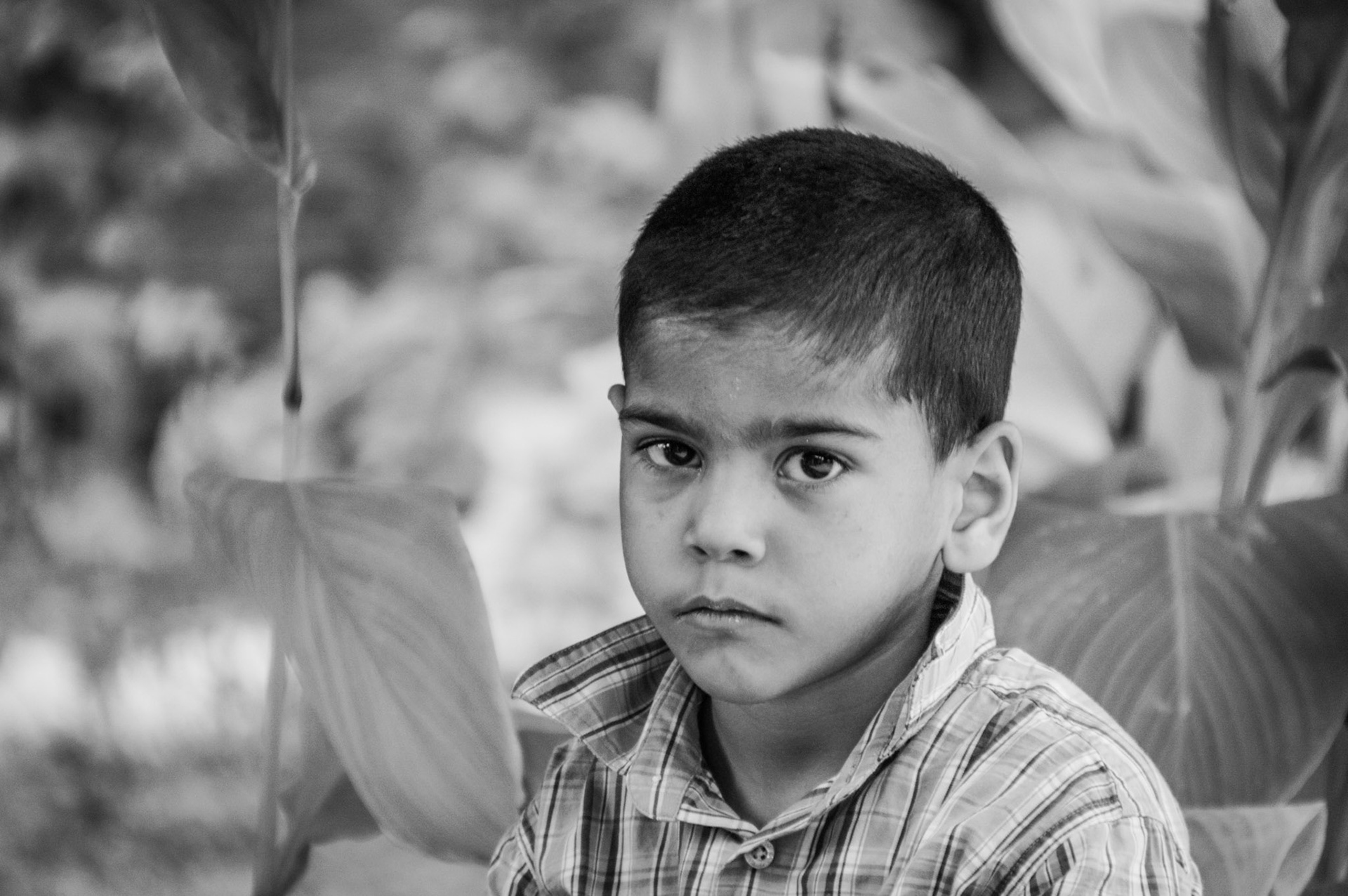 Little kid sitting outside Arabahmet Mosque in the north part of Nicosia, Cyprus