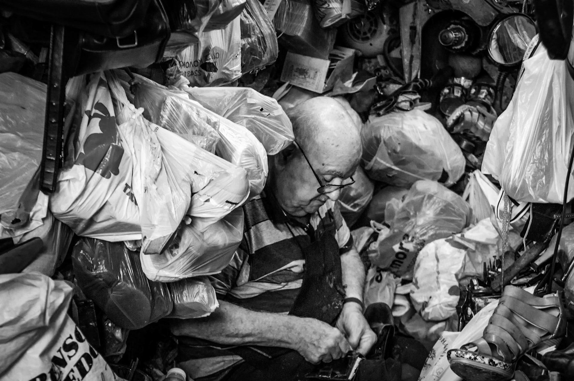 Old man fixing shoes in Old Nicosia, Cyprus