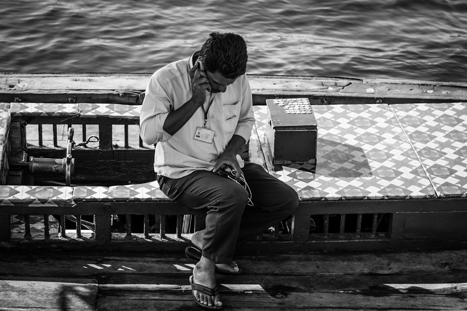 Abra driver on his boat taking his break in Dubai Creek, UAE